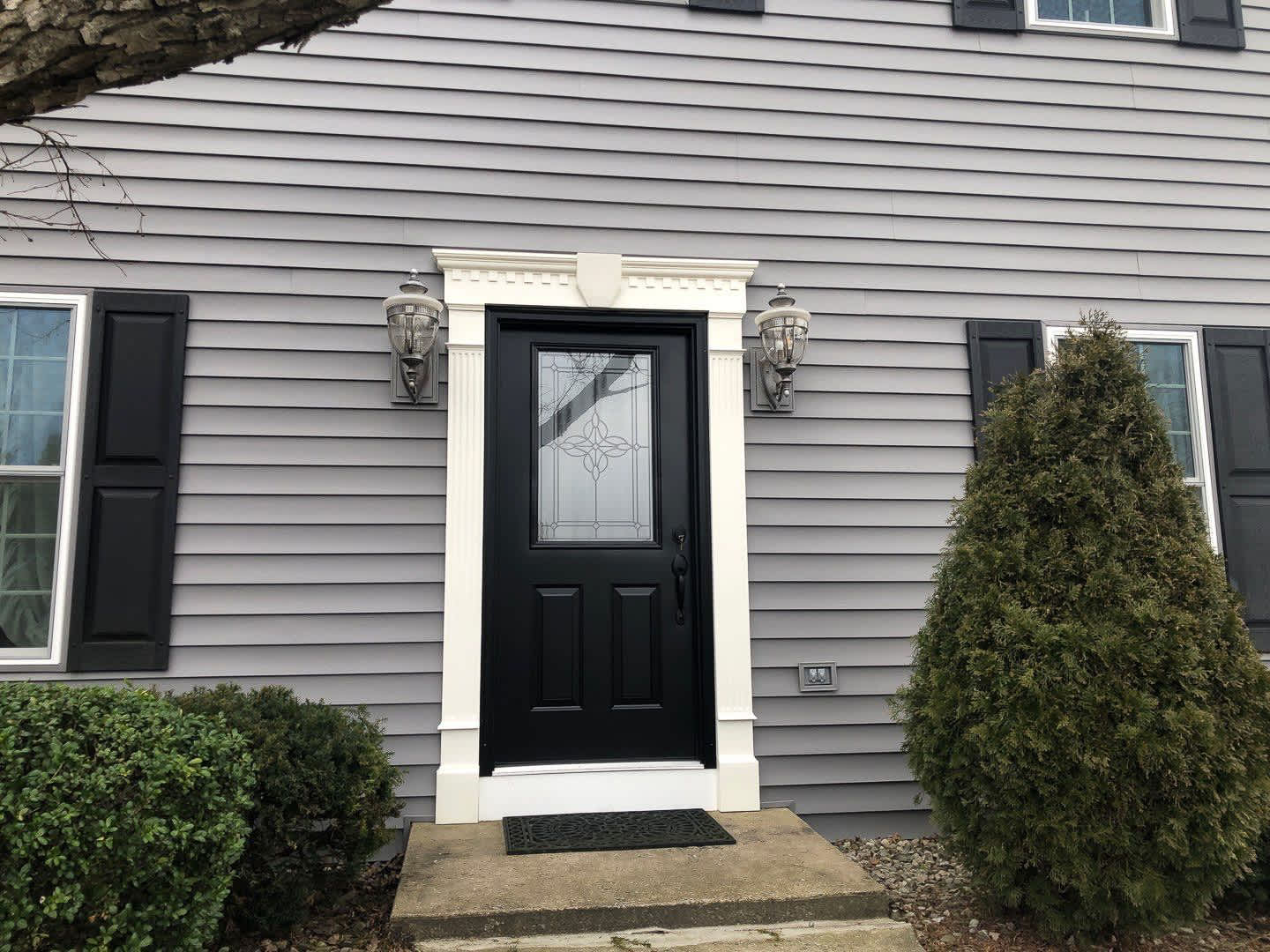 Enhance your home's curb appeal with high-quality door and siding installation from Mast Roofing & Construction.