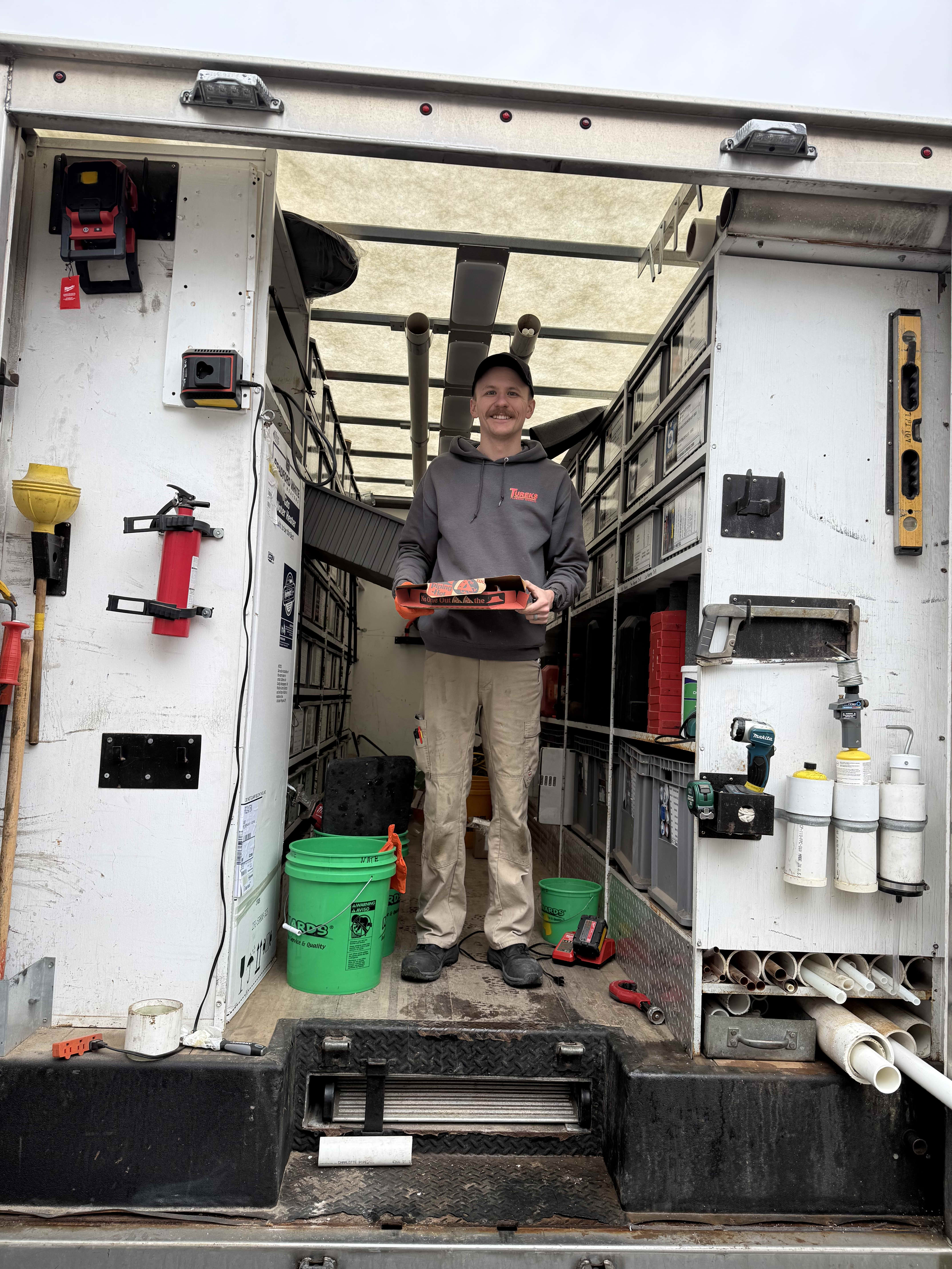 A friendly Tureks Plumbing Services technician arrives prepared and organized to deliver reliable, professional plumbing care on site.