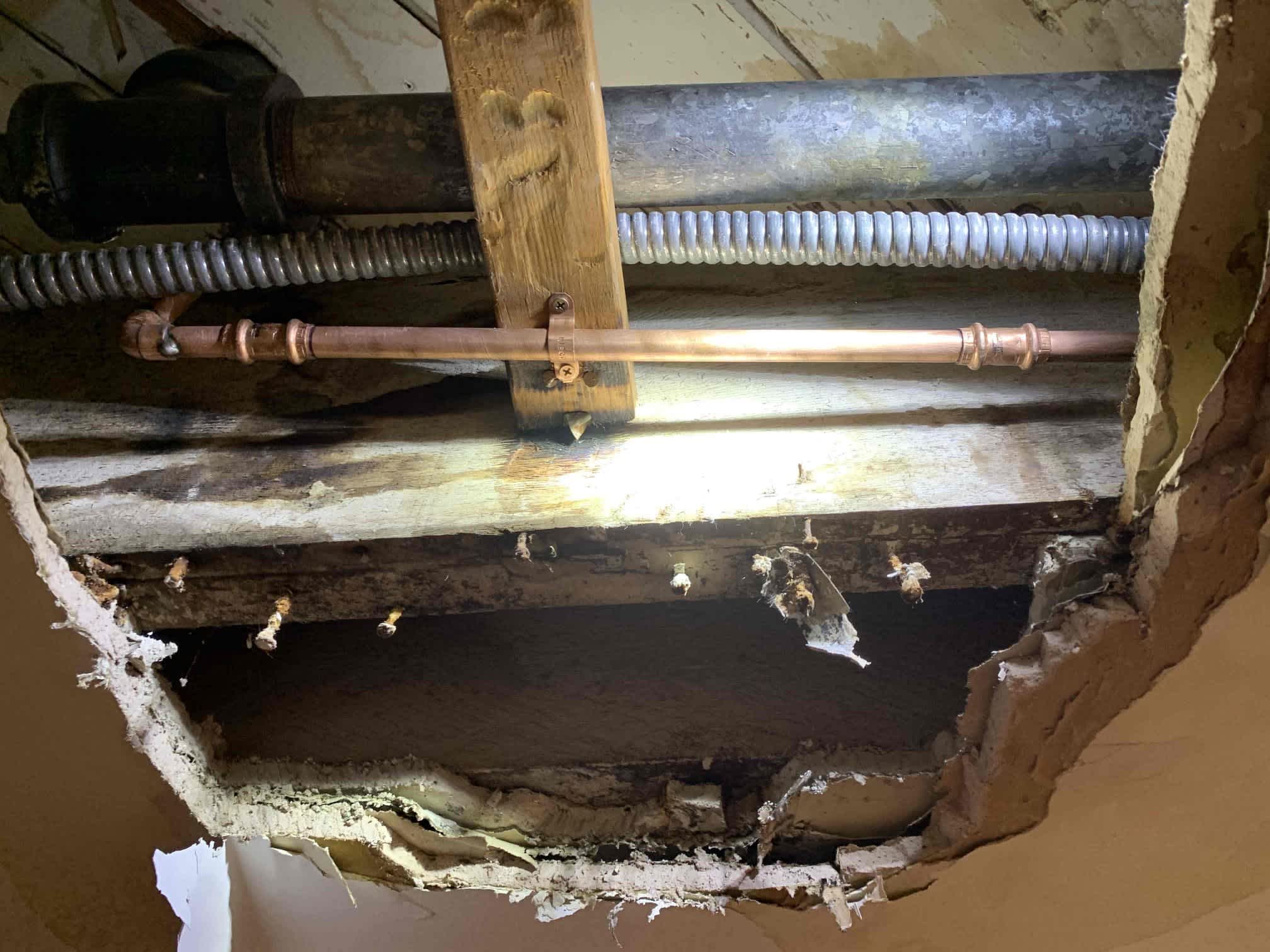 Neat copper piping and secure support show the reliable workmanship customers trust from Magic Plumbing Heating & Cooling when repairing home water lines.