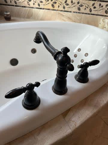 Eric's Plumbing & Drain Cleaning enhances your bathroom's elegance with professional and reliable plumbing services.