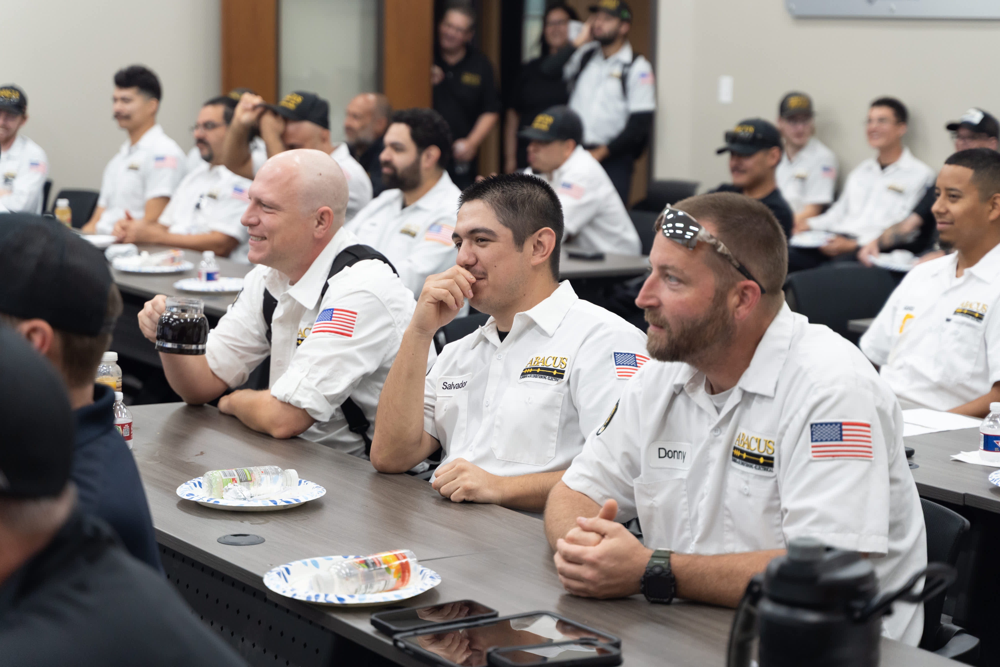 Team members gathered for training show the professionalism and care Abacus Plumbing, Air Conditioning, & Electrical brings to every job.