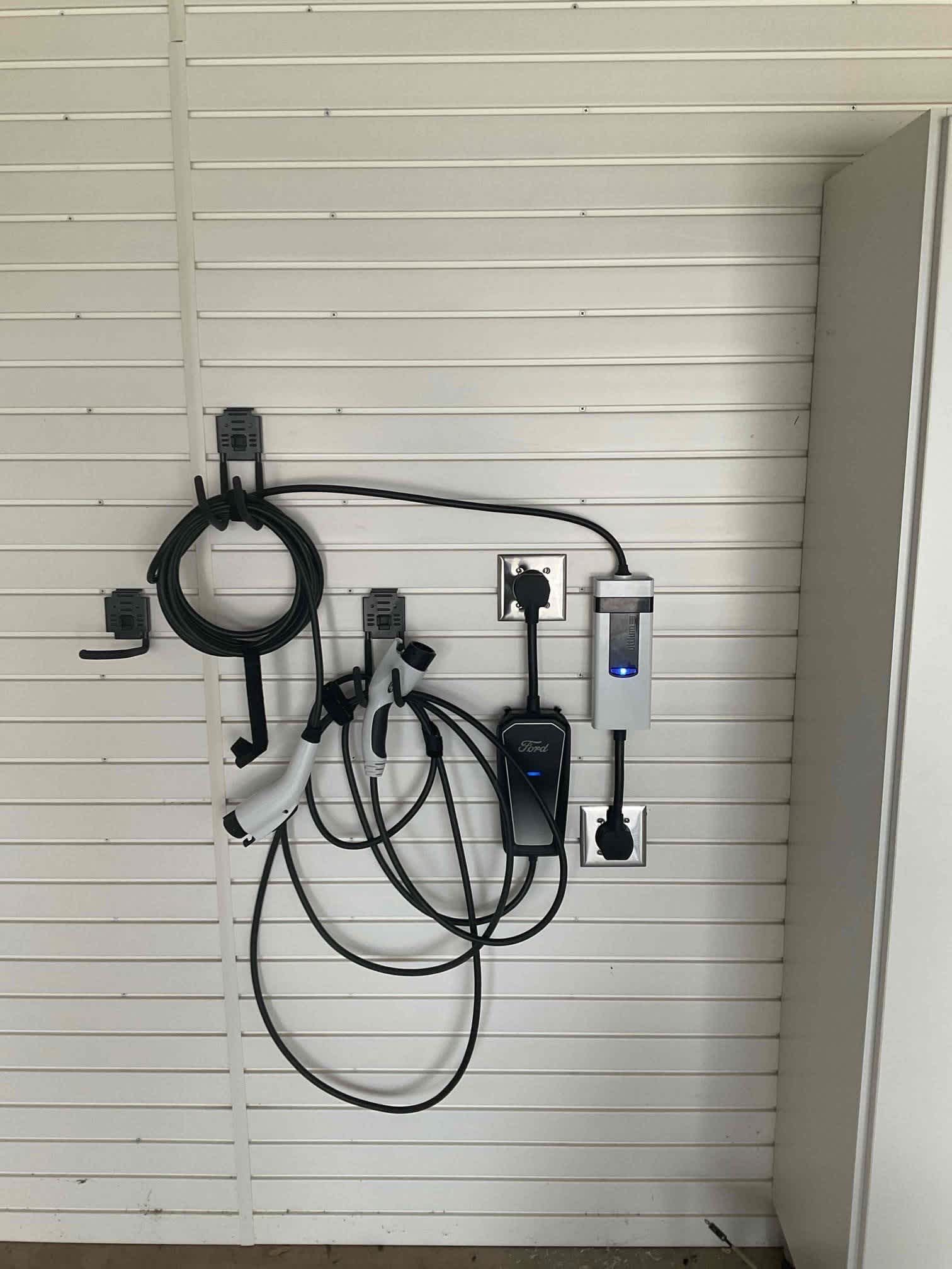 A neatly installed EV charging station and cable organization show reliable craftsmanship and care from West Houston Electric, Inc.