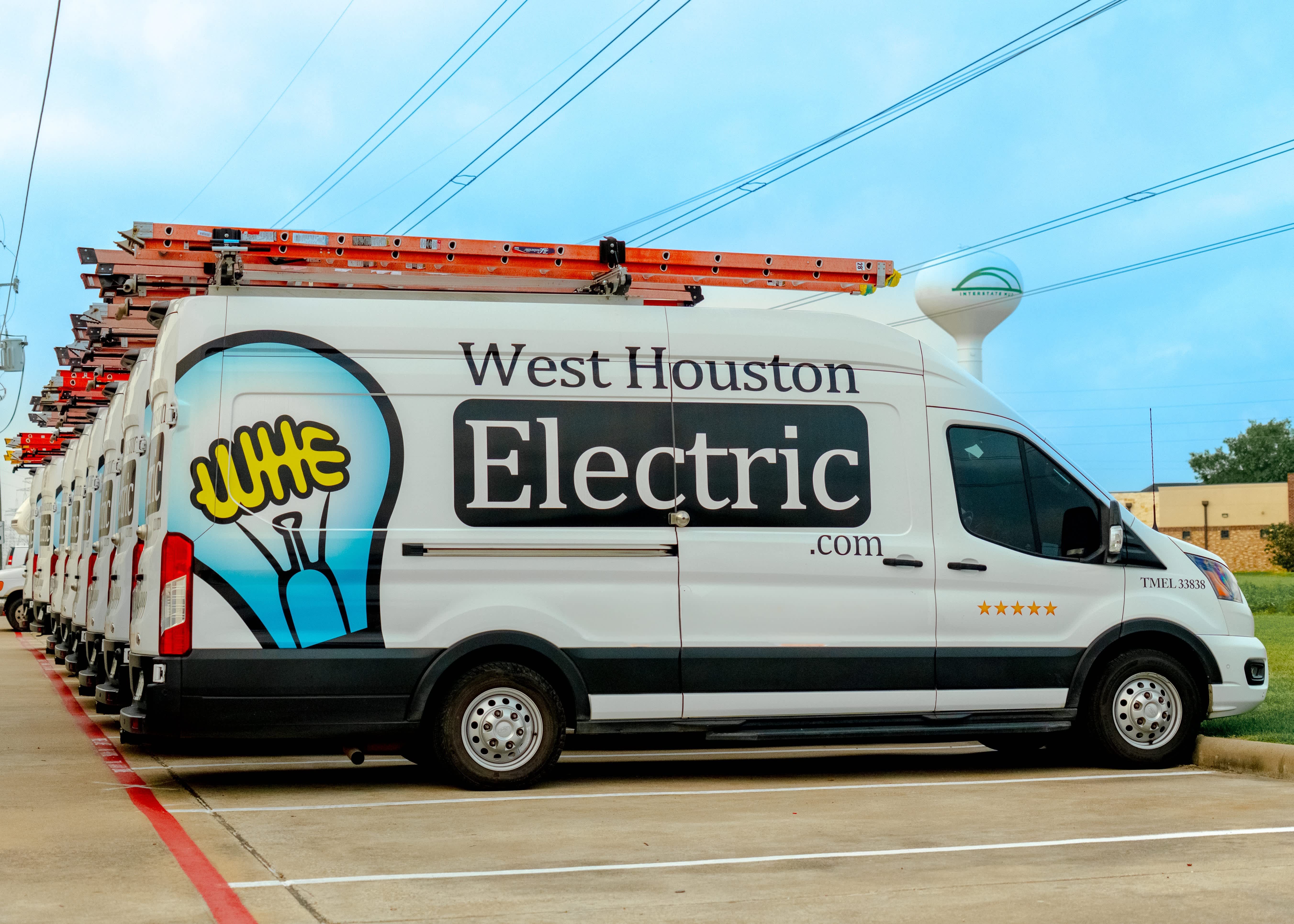A professional fleet and well maintained equipment show how West Houston Electric, Inc. delivers dependable electrical service with visible readiness.