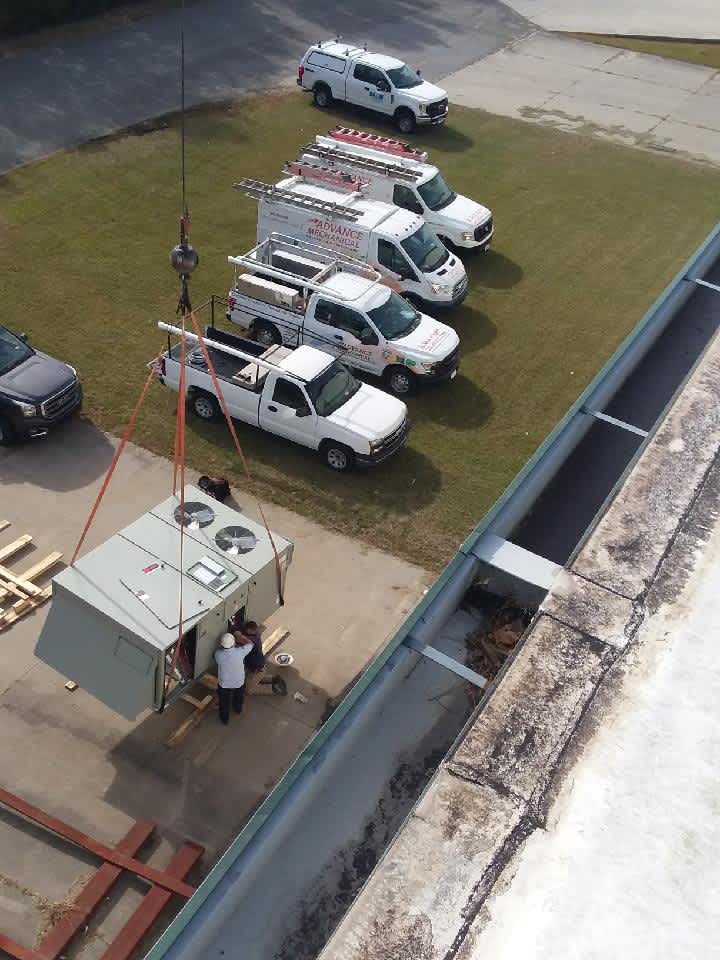 Advance Mechanical Heating & Air Conditioning: Excellence in HVAC installation, showcasing professionalism and top-quality equipment handling.