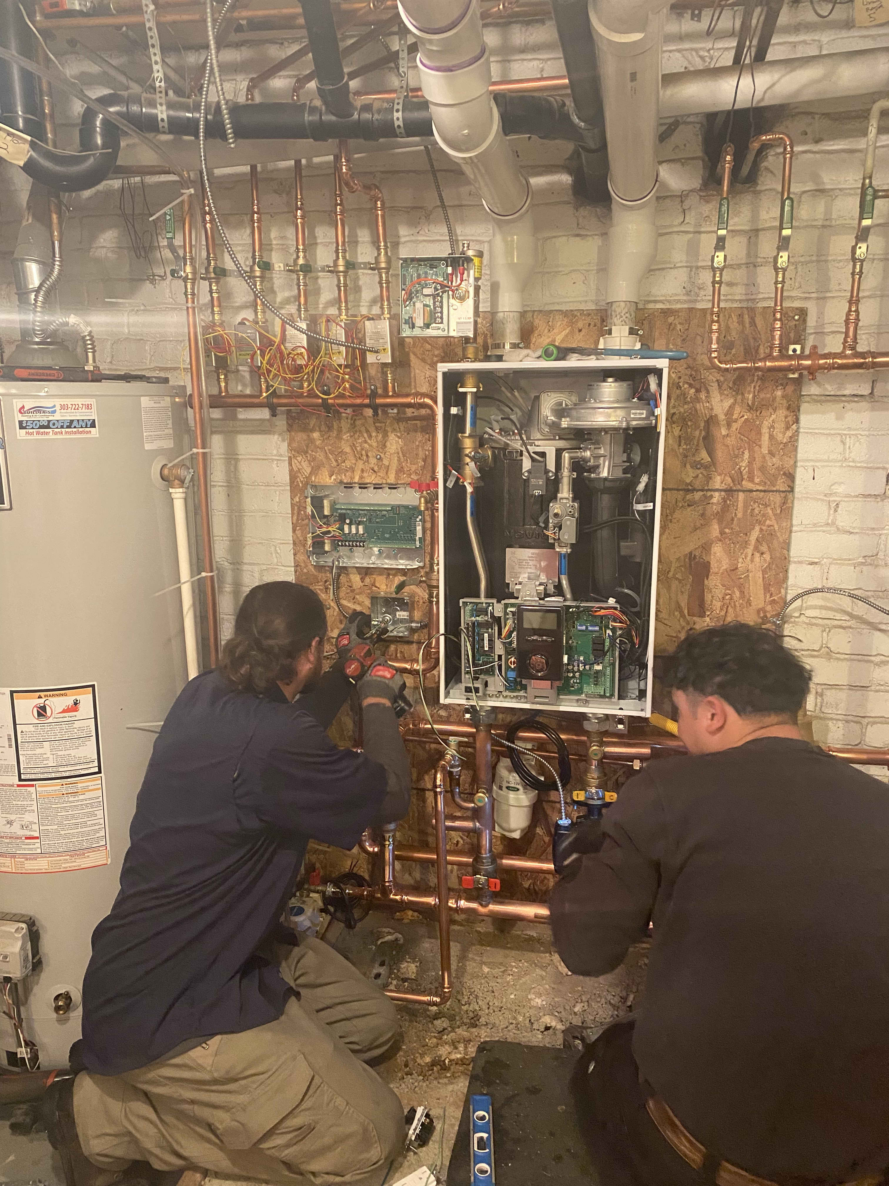 At Bell Plumbing, Heating, Cooling & Electrical, we ensure high-quality service, as showcased by our expert technicians meticulously managing complex systems to perfection.