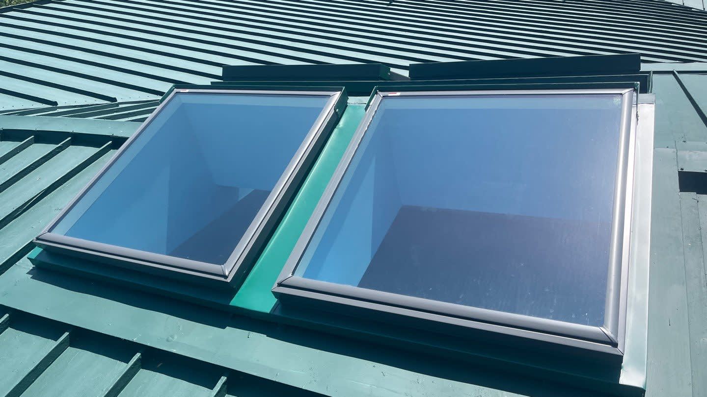Enhance your home with precision skylight installations by Mast Roofing & Construction.