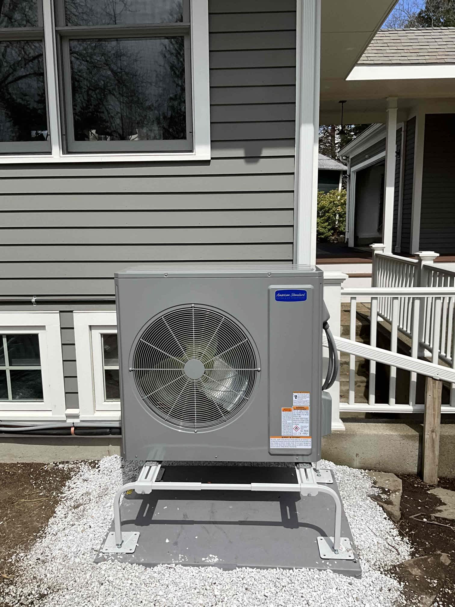 A tidy, professionally installed outdoor HVAC unit shows the care and craftsmanship customers expect from Akian Plumbing, Heating, Cooling & Electric.