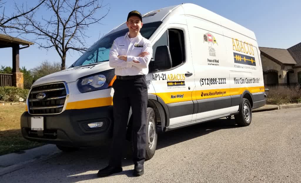 Friendly, uniformed technicians and branded vans show Abacus Plumbing, Air Conditioning, & Electrical delivering reliable, professional home service.