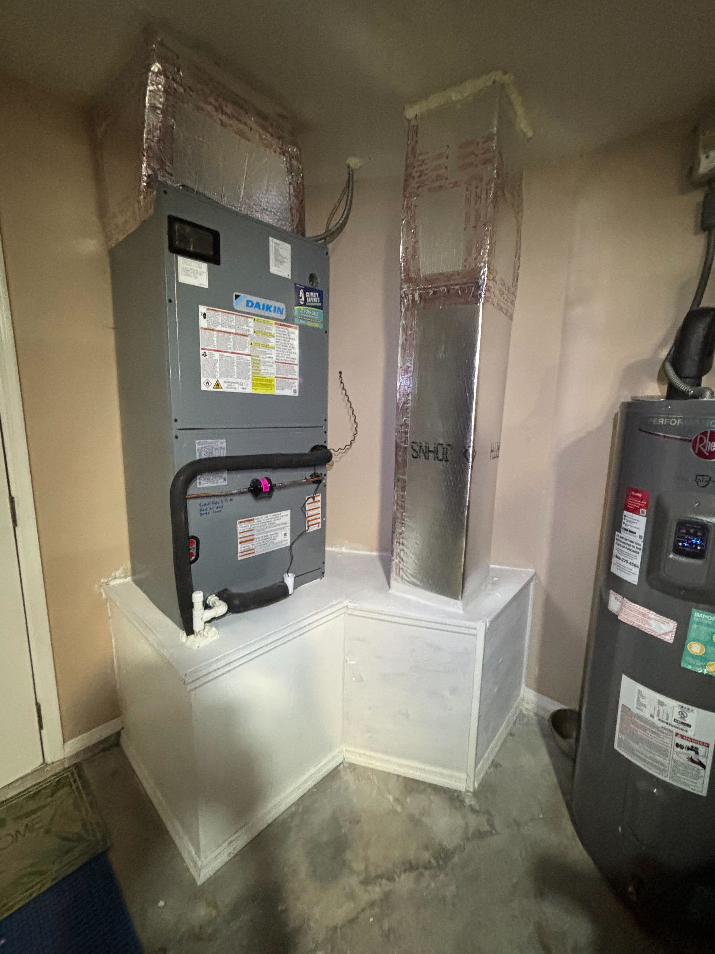 A clean, professionally installed air handler and insulated ductwork highlight Climate Experts Air, Plumbing & Electric commitment to reliable, efficient comfort.