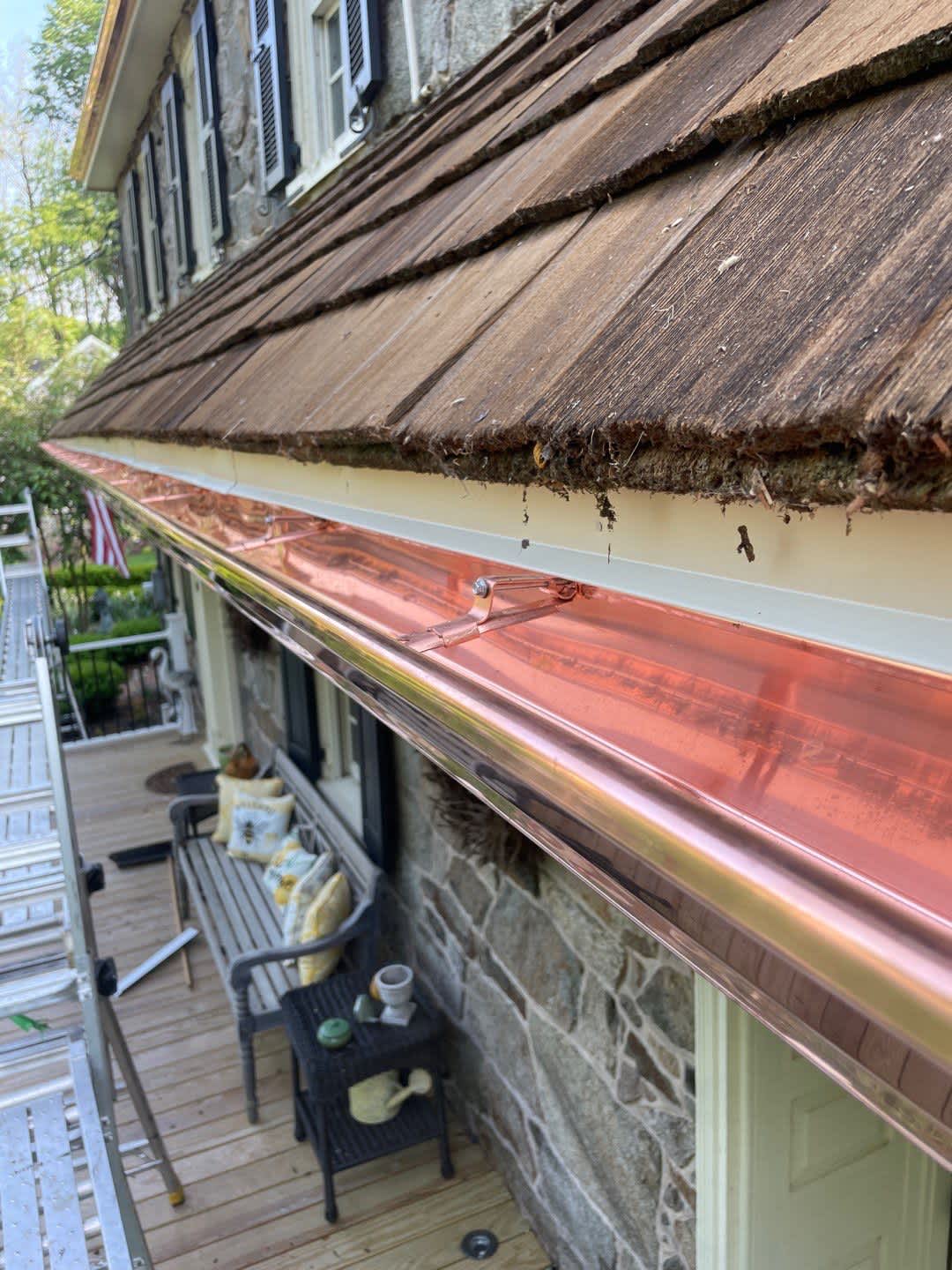 Enhance your home's curb appeal with expert copper gutter installations that promise lasting quality and style by Mast Roofing & Construction.