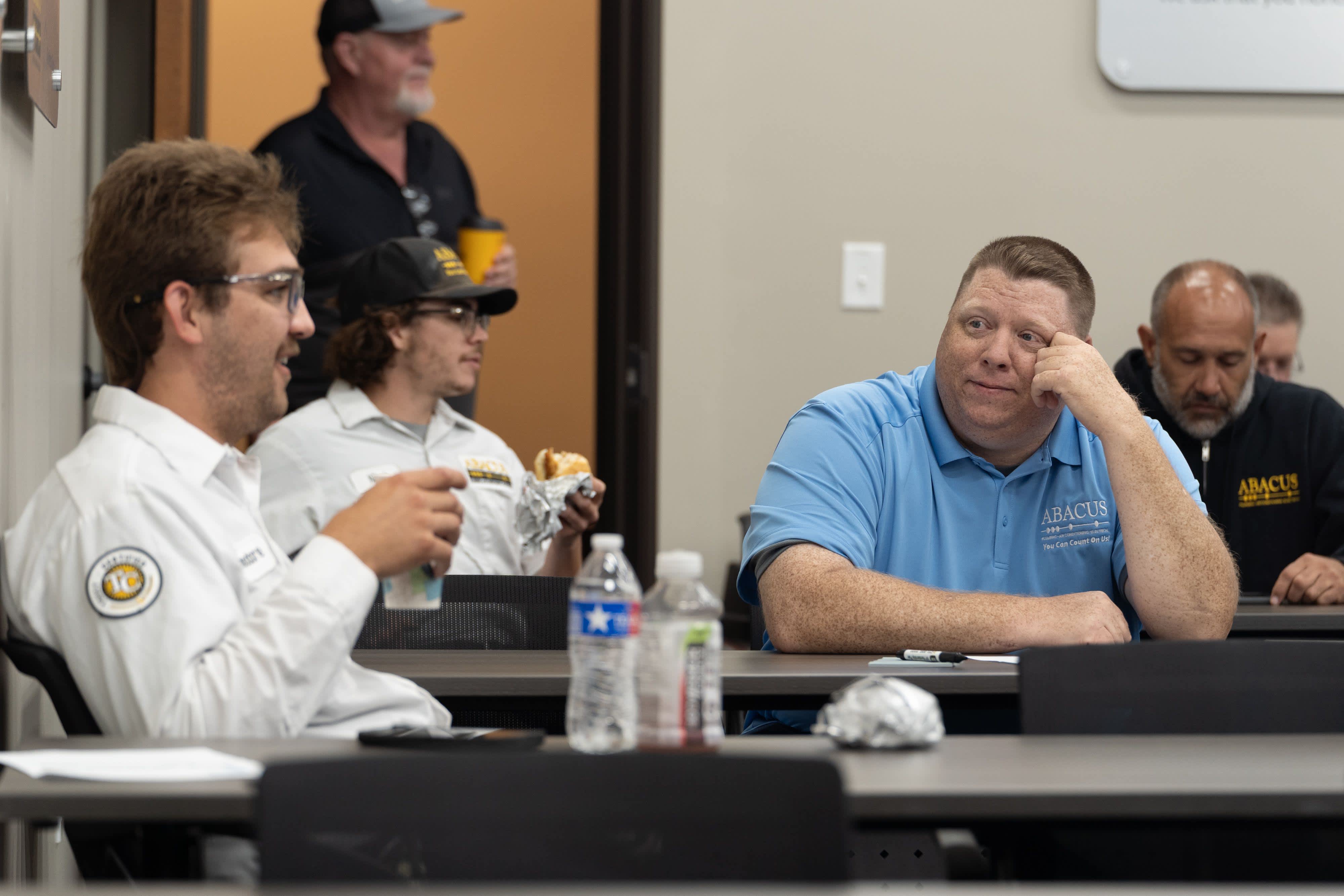 Abacus Plumbing, Air Conditioning, & Electrical demonstrates its commitment to ongoing training and dependable customer service through engaged team collaboration.