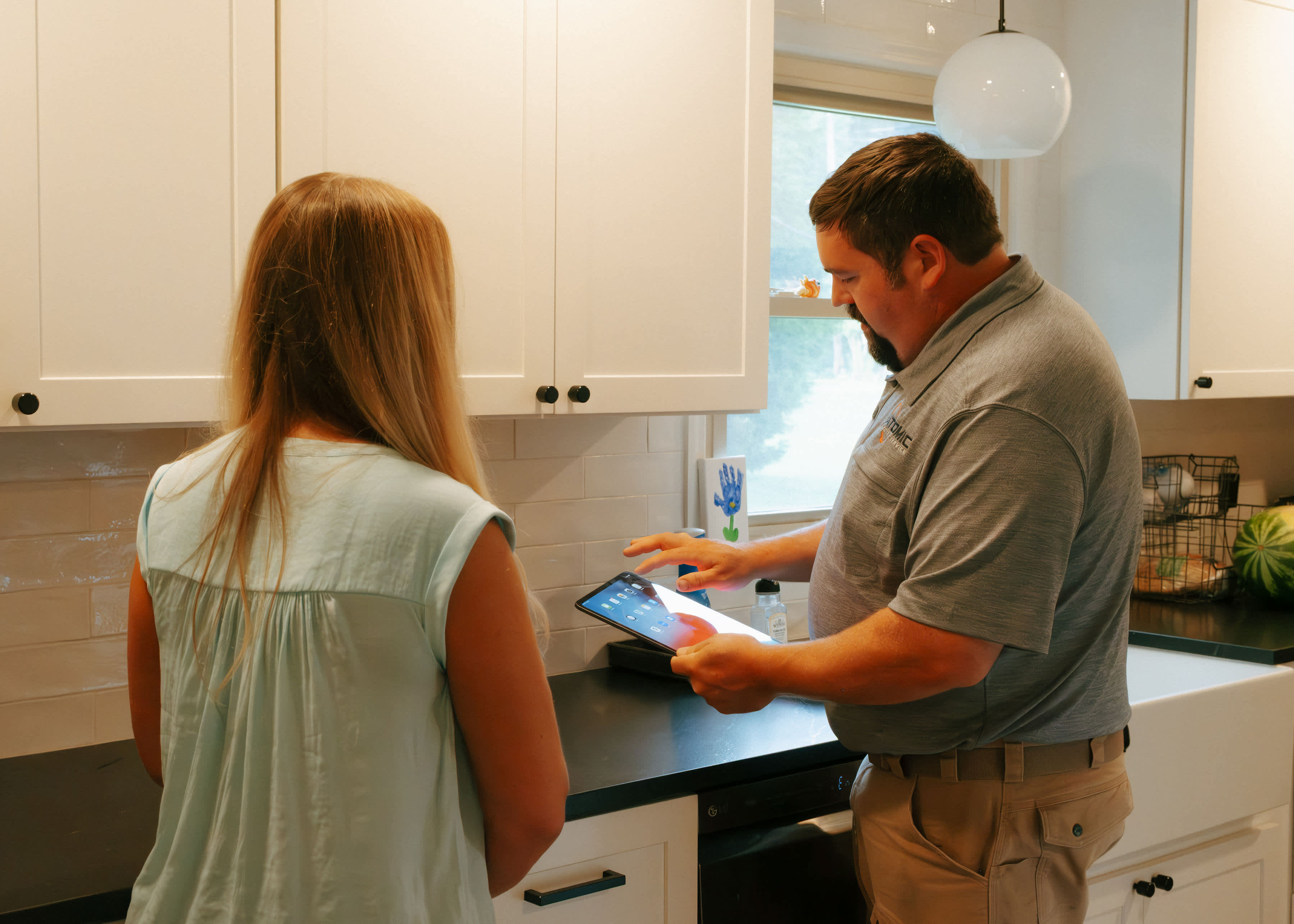 Experience effortless home upgrades with Atomic Electric Service Inc., where modern solutions meet exceptional service in your kitchen.
