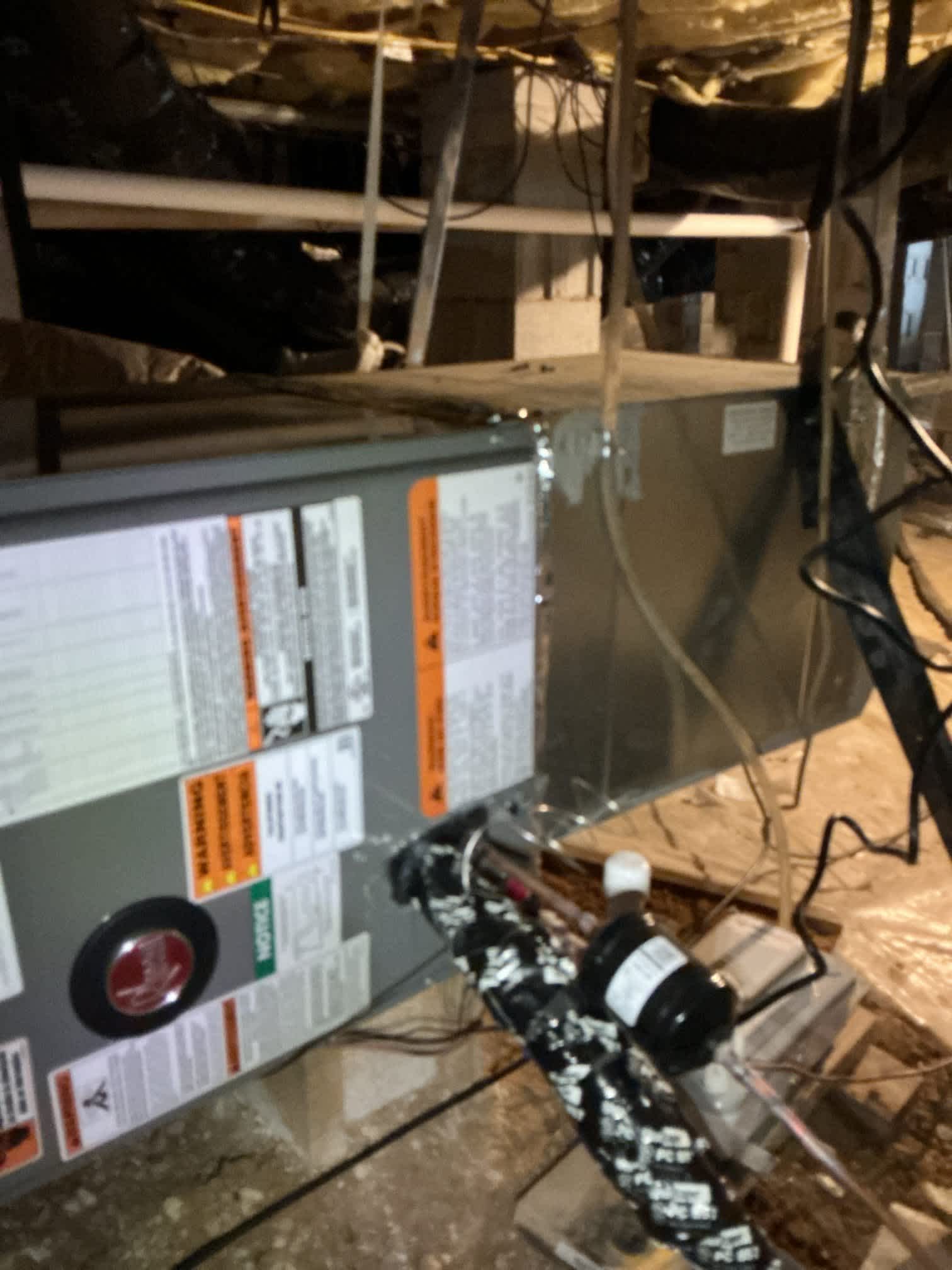 Dawson's Electric & Air demonstrates reliable craftsmanship with a well-sealed air handler and properly installed condensate pump for lasting performance.