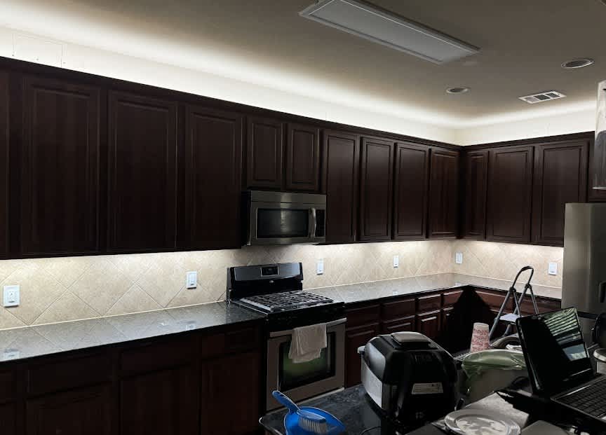 Beautifully finished kitchen lighting and clean installations show Abacus Plumbing, Air Conditioning, & Electrical delivering reliable, detail-oriented service.