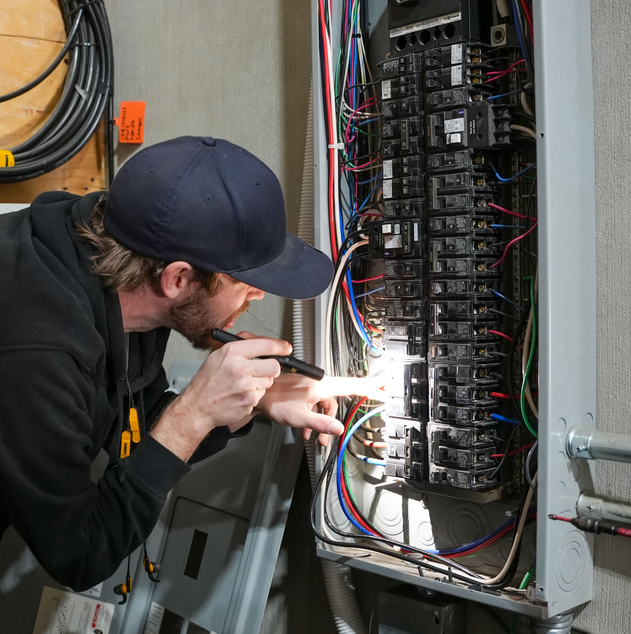 Skilled technicians from Eco Electric, Plumbing, Heating and Air carefully inspect electrical panels to ensure safe, reliable power for your home.