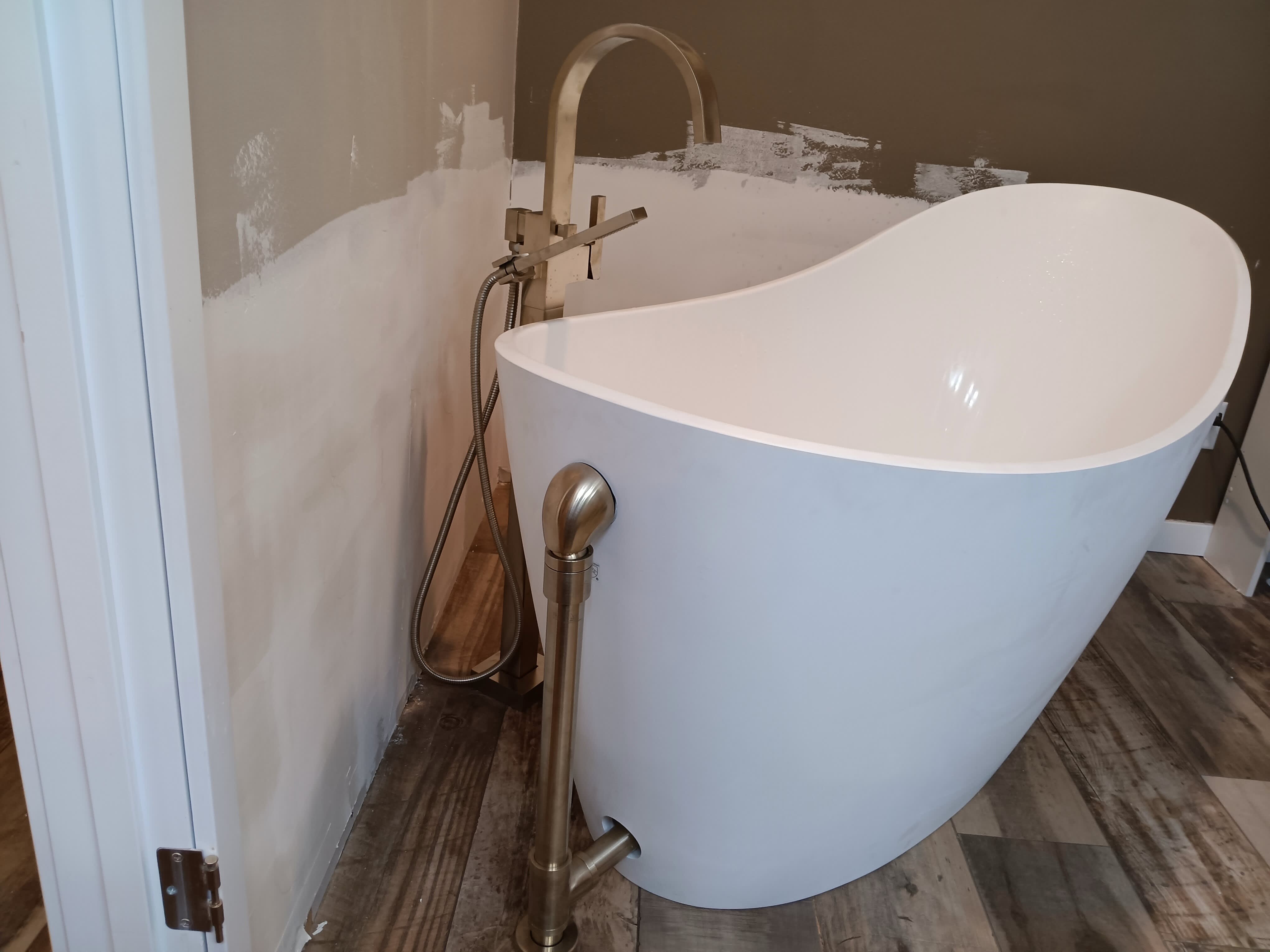 Experience modern elegance with Lanz Plumbing, Heating & Cooling, Inc., your trusted provider for quality bathroom installations.