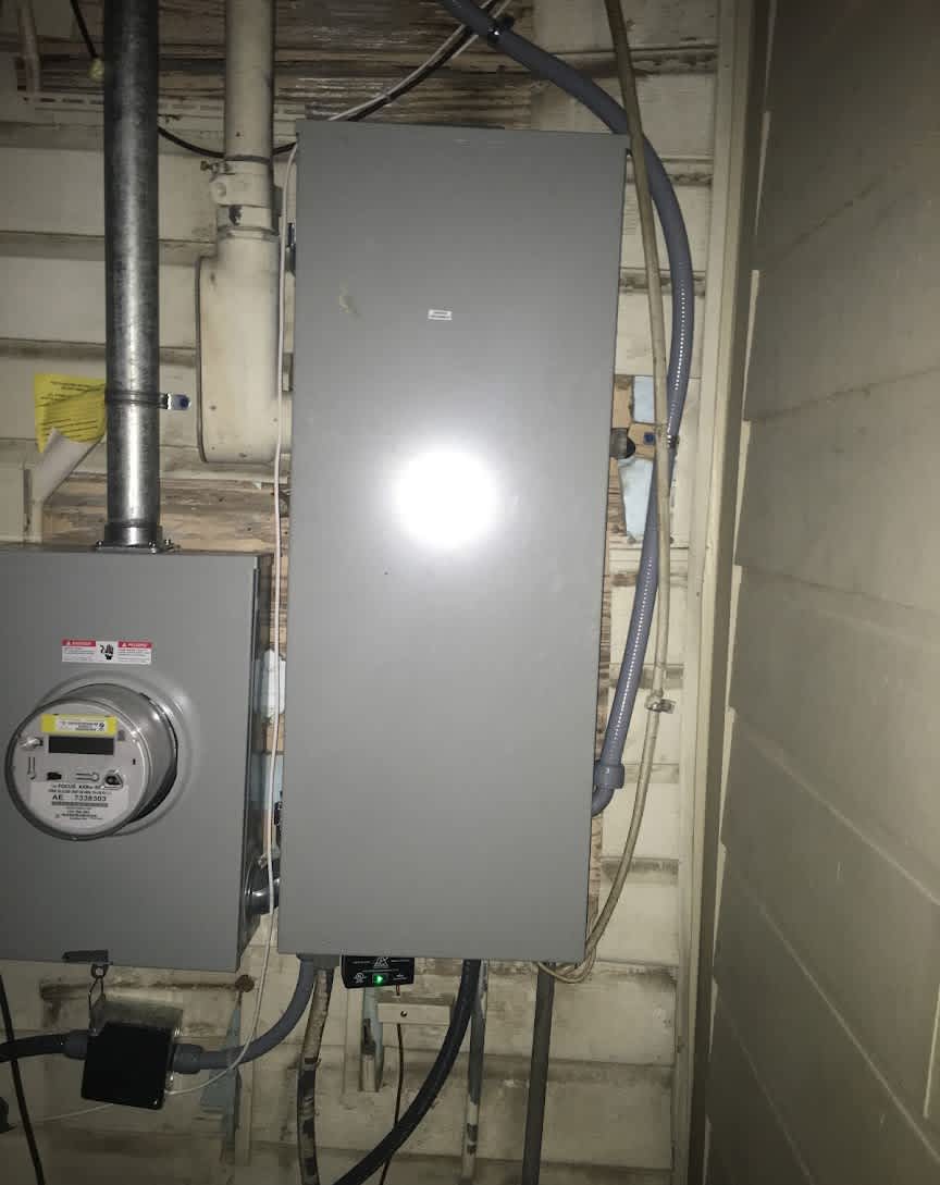 Professional electrical panel work from Abacus Plumbing, Air Conditioning, & Electrical shows reliable installation and tidy conduit routing for peace of mind.