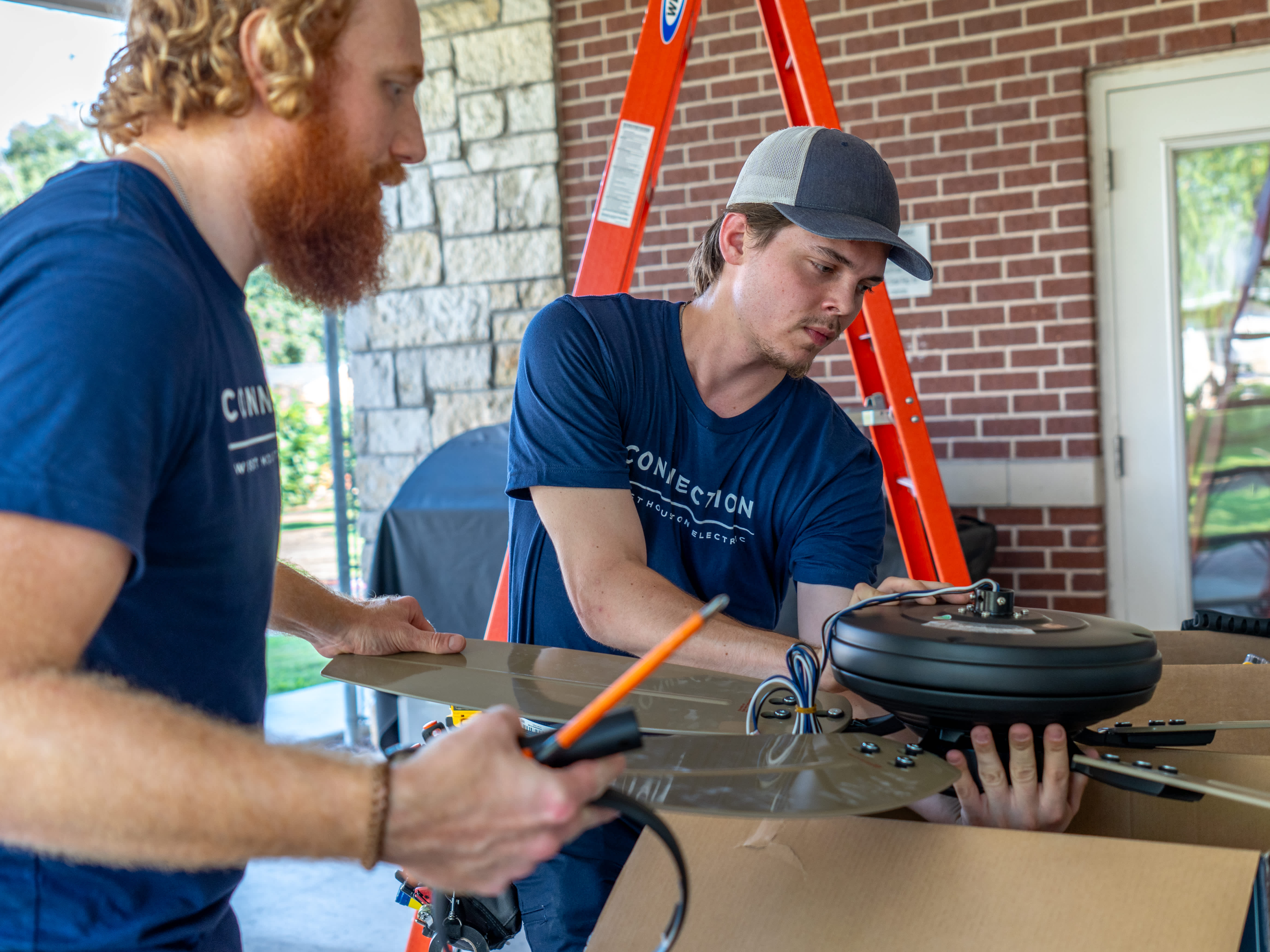 Skilled technicians from West Houston Electric, Inc. carefully assemble a ceiling fan on-site, delivering reliable workmanship and peace of mind.