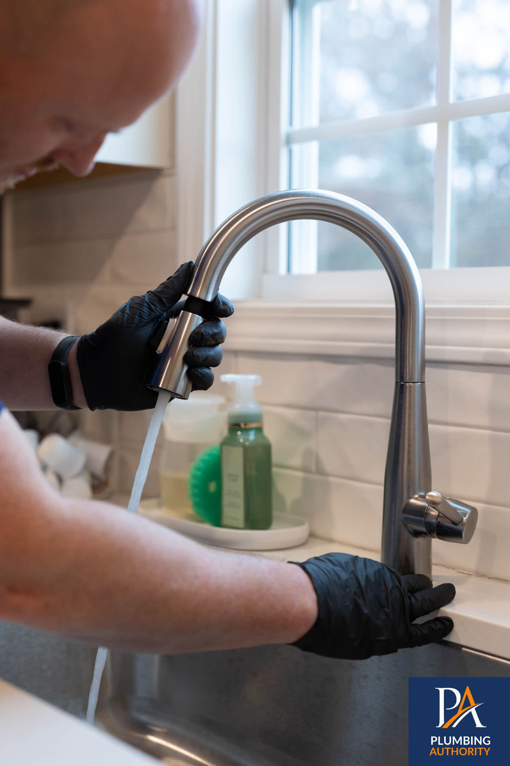 Confident, careful faucet service in your kitchen shows The Plumbing Authority's commitment to professionalism and clean workmanship.