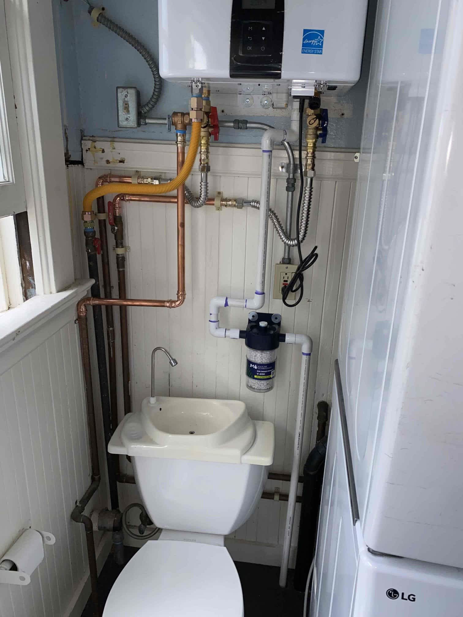 A tidy, space-saving plumbing install shows the care and craftsmanship customers trust from Magic Plumbing Heating & Cooling.