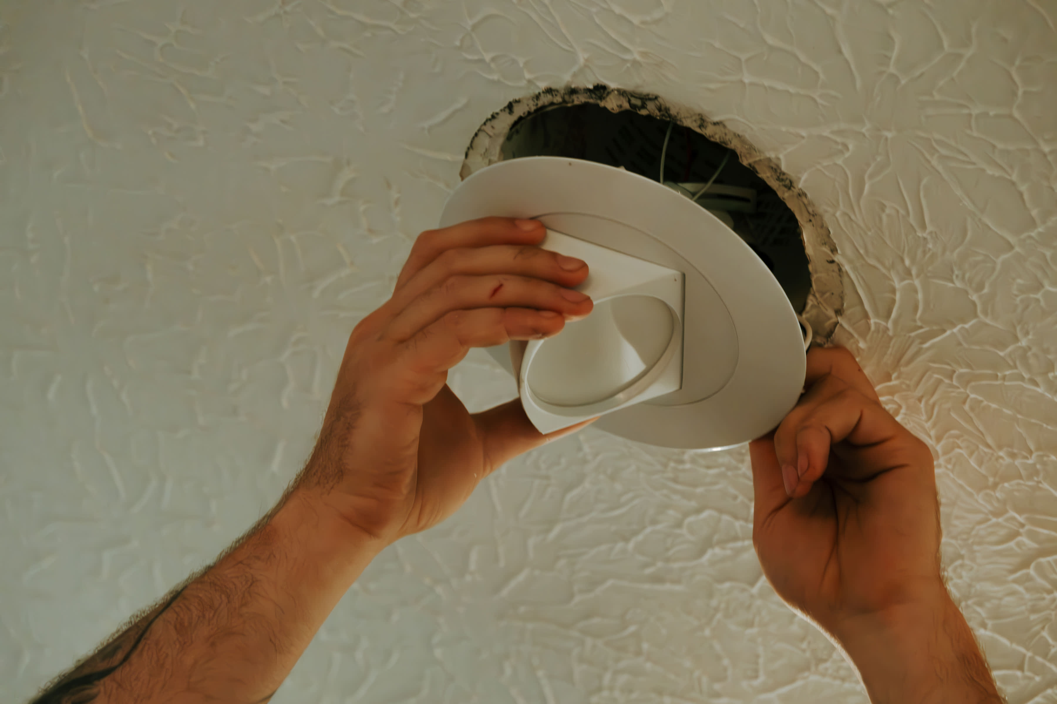 Enhance your home’s lighting with precision installations by Atomic Electric Service Inc., bringing expertise right to your ceiling.