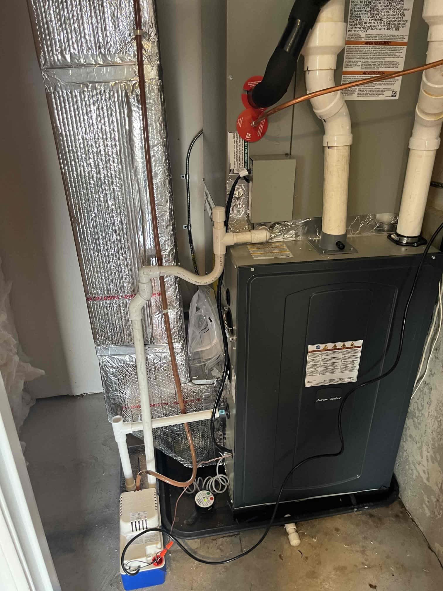 Reliable craftsmanship kept the furnace area clean and functional, showcasing Akian Plumbing, Heating, Cooling & Electric’s dependable HVAC service.