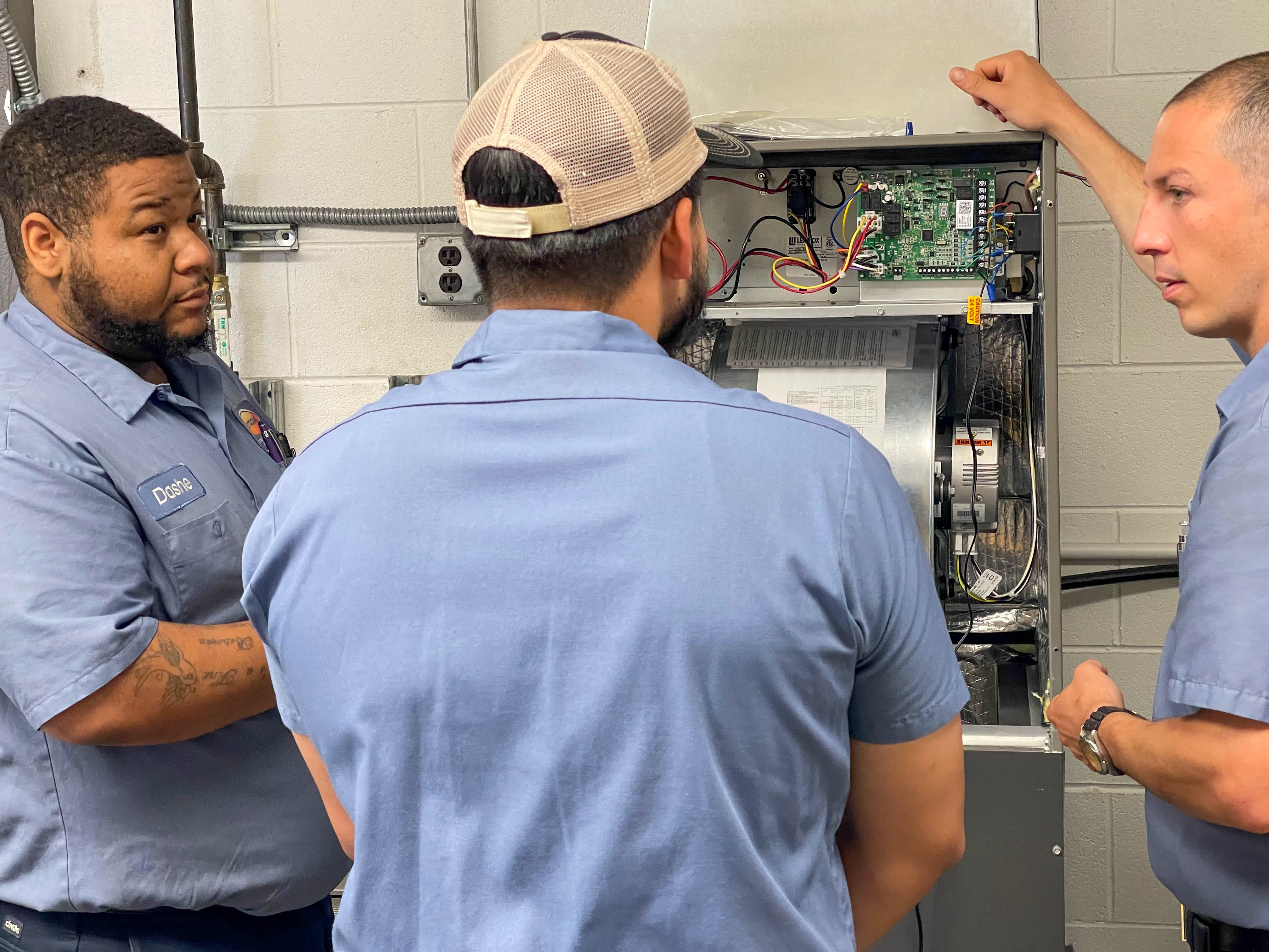 Ostrom Electrical Plumbing Heating & Air Conditioning: Delivering expert HVAC solutions with precision and teamwork.