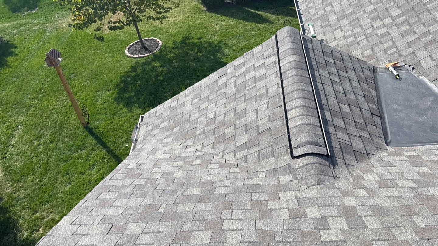 Expert craftsmanship and durable shingle installation visible from above, showcasing the reliable results Mosaic Roofing & Exteriors delivers.