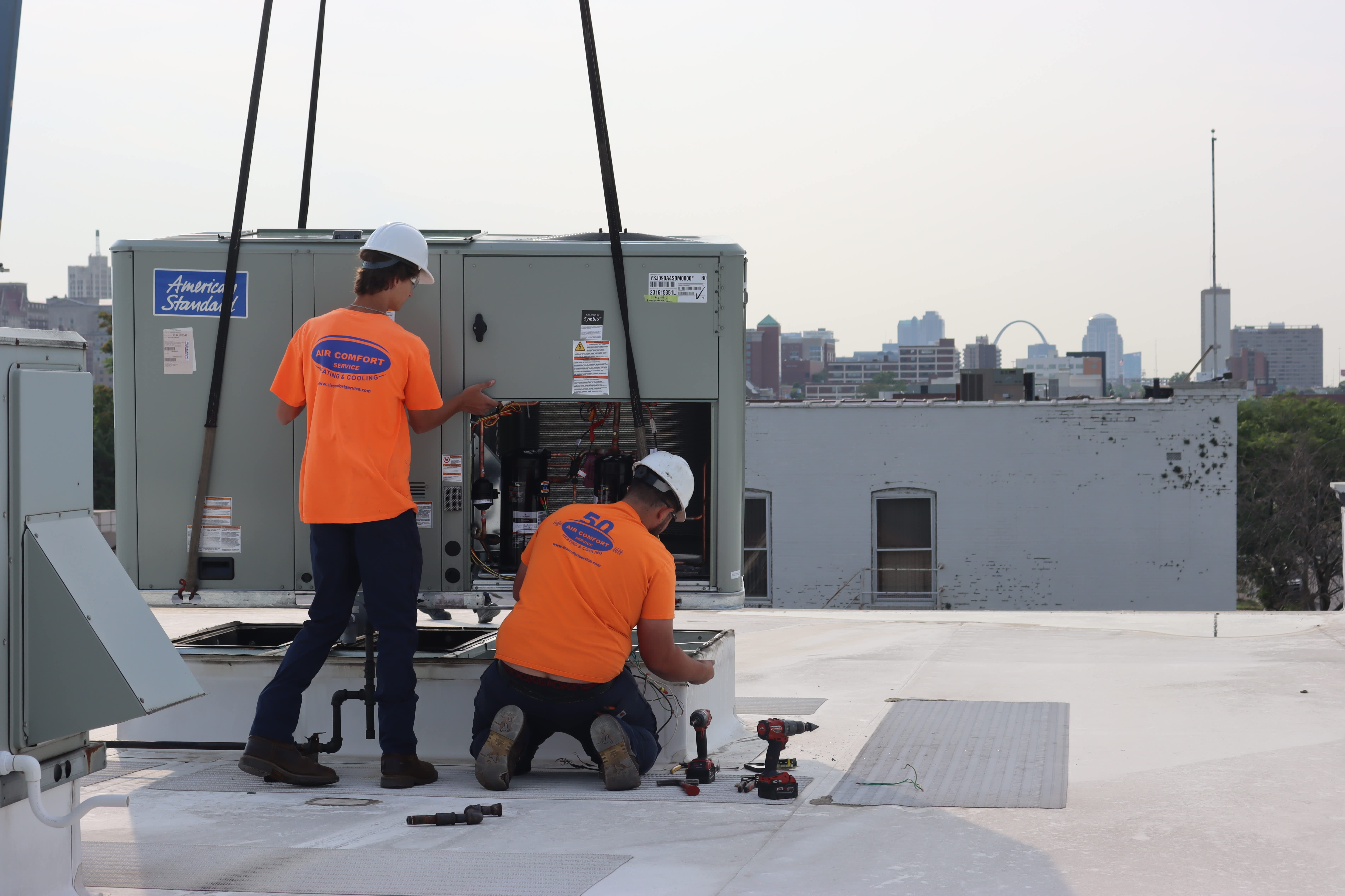 At Air Comfort Service, Inc., our dedicated team ensures your HVAC systems are efficiently managed with professionalism against the backdrop of your city skyline.