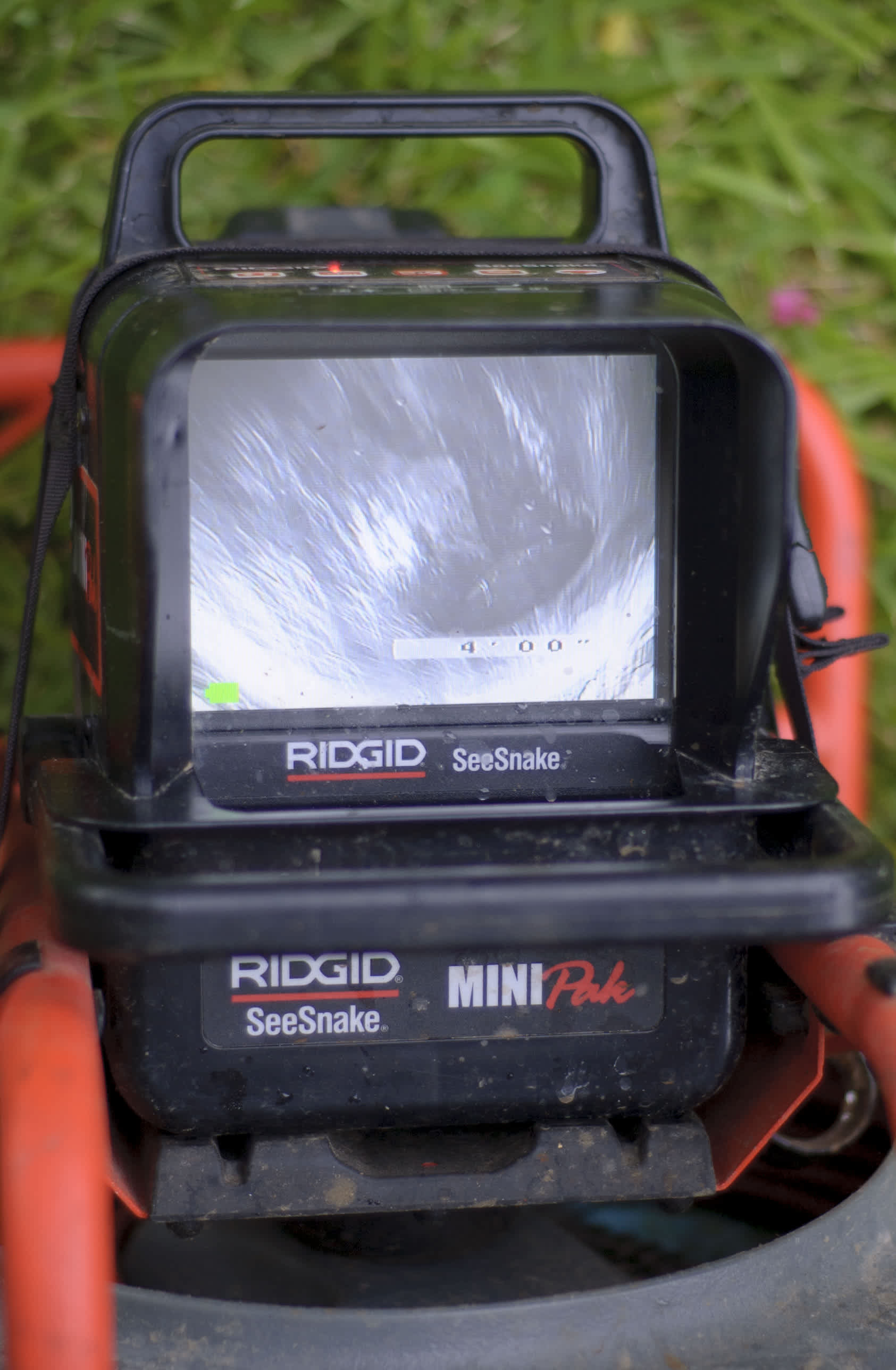 Abacus Plumbing, Air Conditioning, & Electrical demonstrates reliable on-site diagnostics using professional RIDGID inspection gear to ensure thorough service.