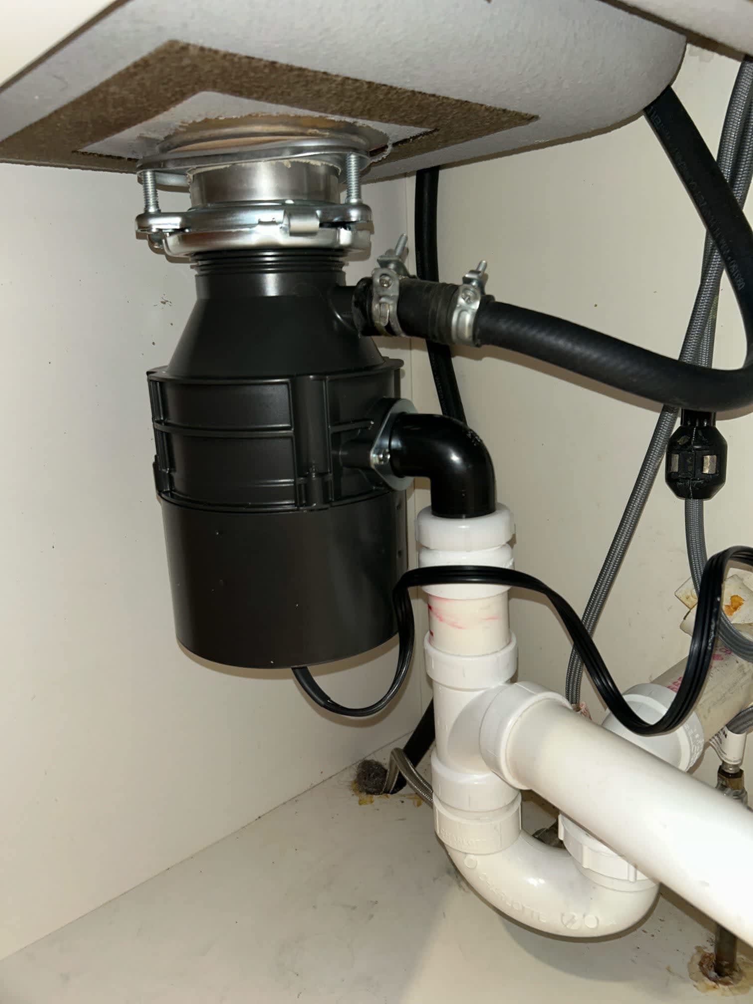 Experience seamless and professional plumbing services with Akian Plumbing, Heating, Cooling & Electric, where quality installations like this efficient garbage disposal are standard.