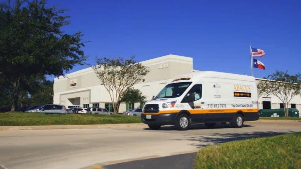 A clean Abacus Plumbing, Air Conditioning & Electrical service van arriving on site conveys dependable, professional service you can trust.