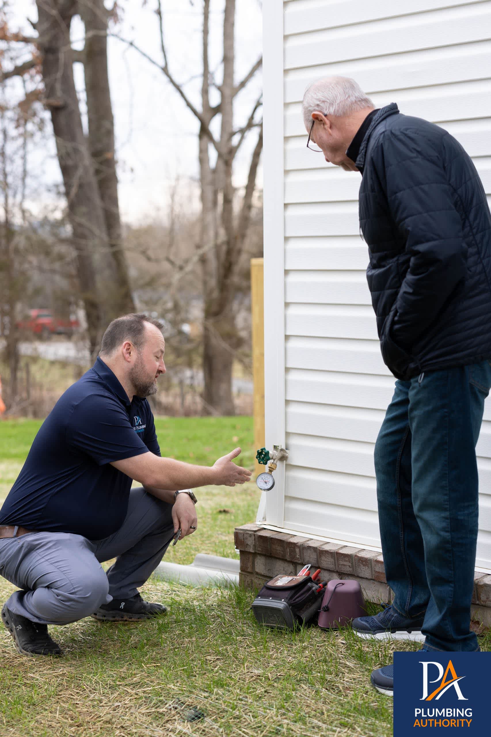 A Plumbing Authority technician inspects your outdoor faucet and explains findings clearly to build trust and ensure dependable service.