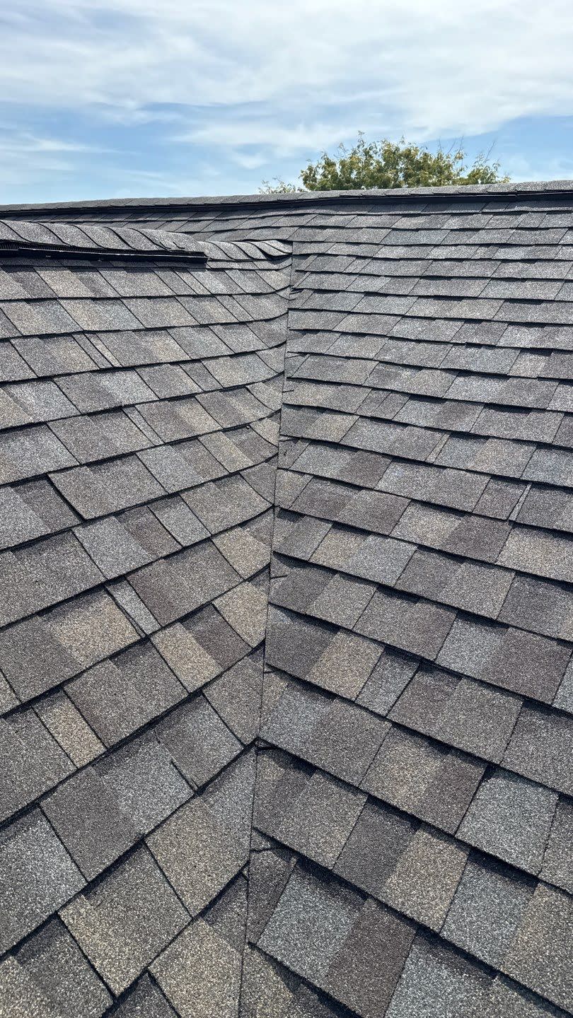 Showcasing precise workmanship and durable asphalt shingle installation, Mosaic Roofing & Exteriors protects homes with attention to roof valleys and detail.