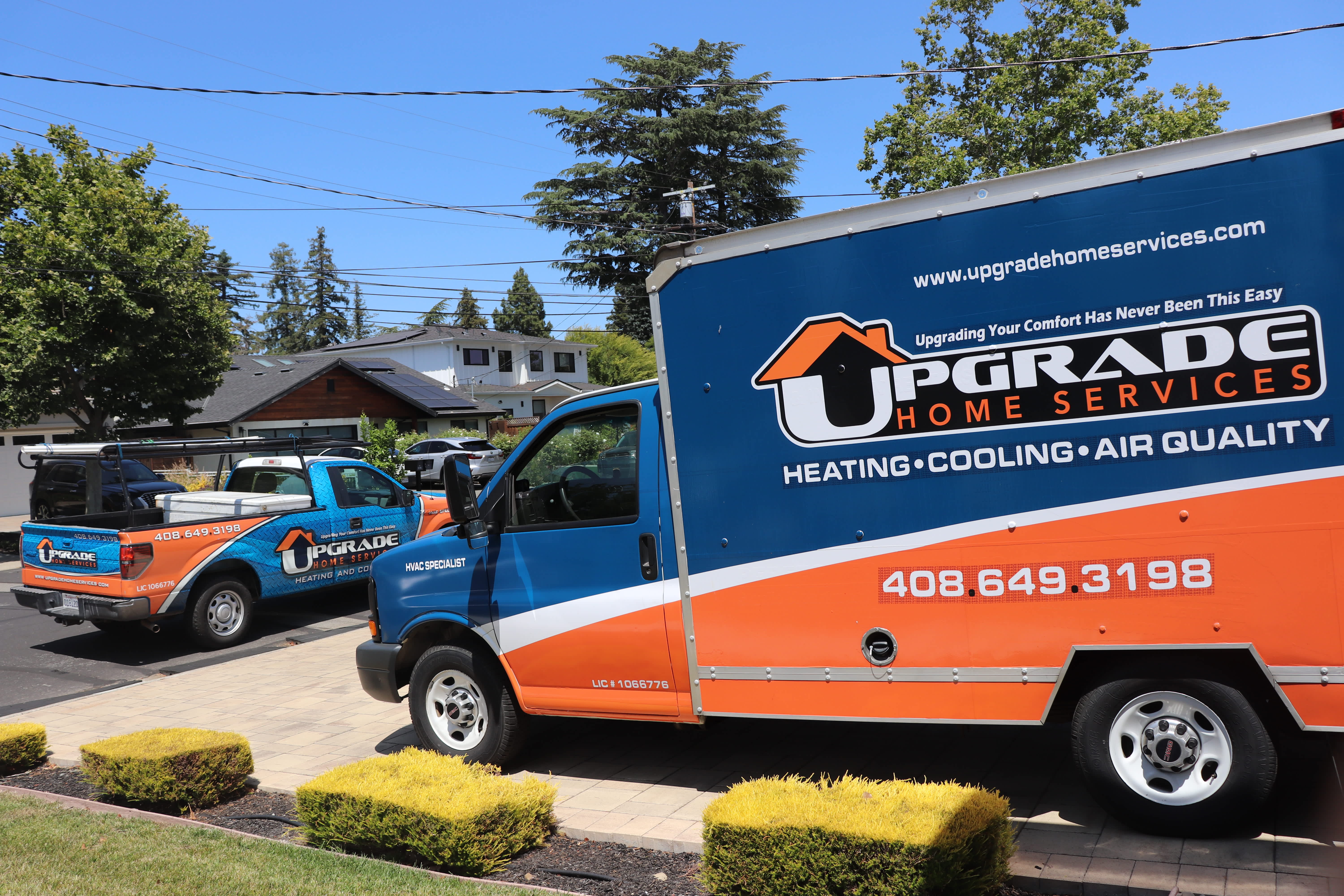 Upgrade Home Services shows reliable, professional HVAC support with clean, branded vehicles and an easy contact number for fast scheduling.