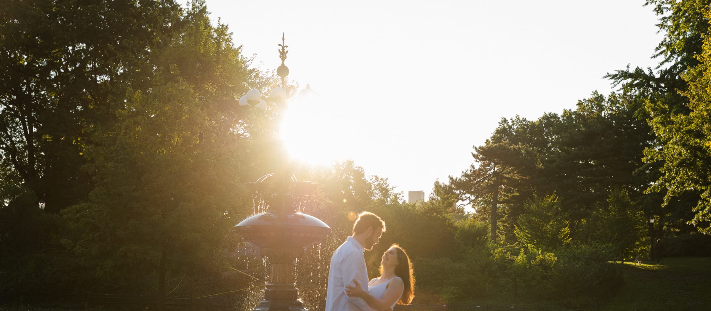Matt and Louise dancing beside Bethesda Fountain at sunrise