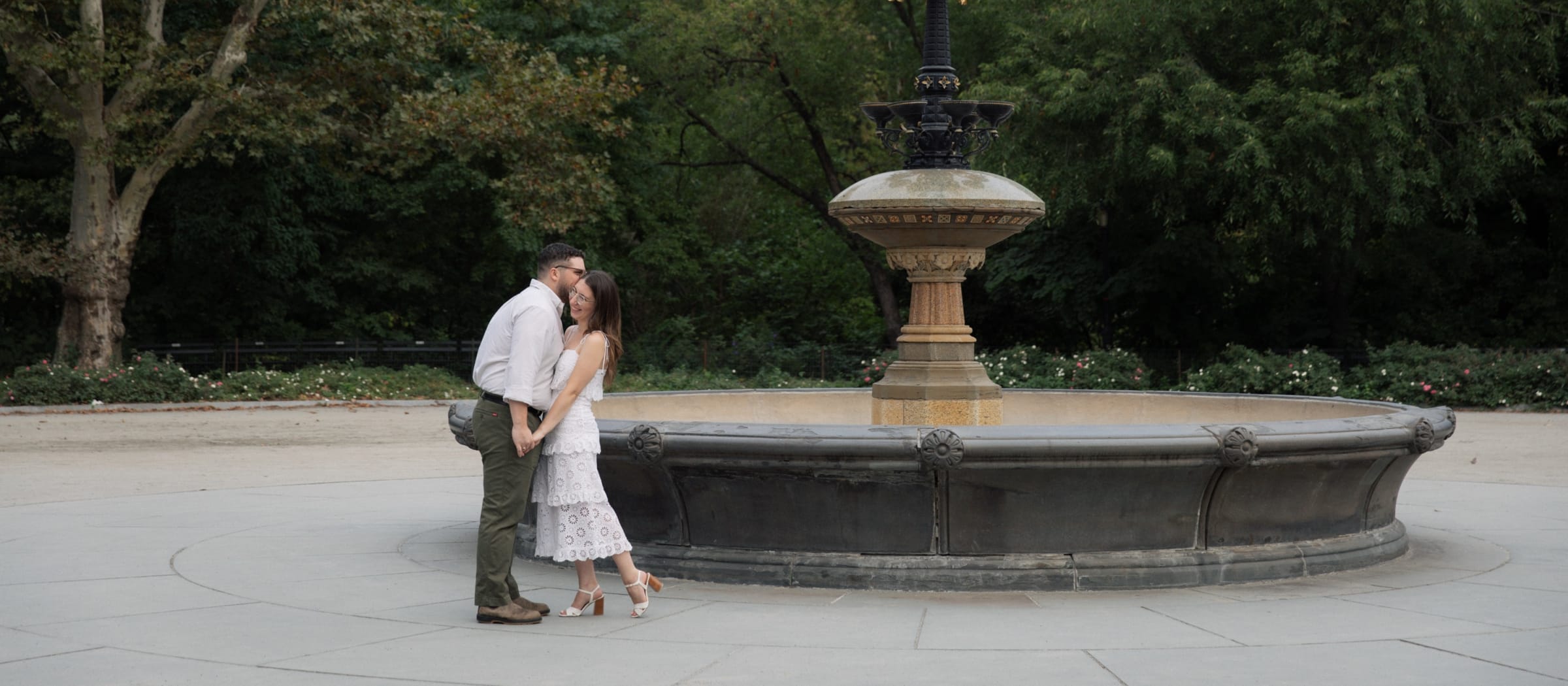 Sydney and Braden kissing beside the Cherry Hill fountain in Central Park