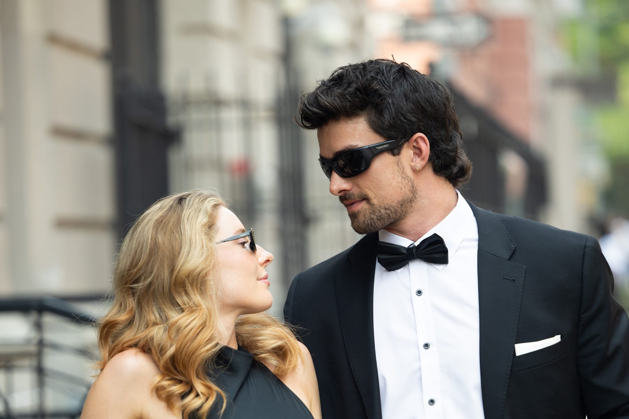 Joana and Ben pausing on a quiet street