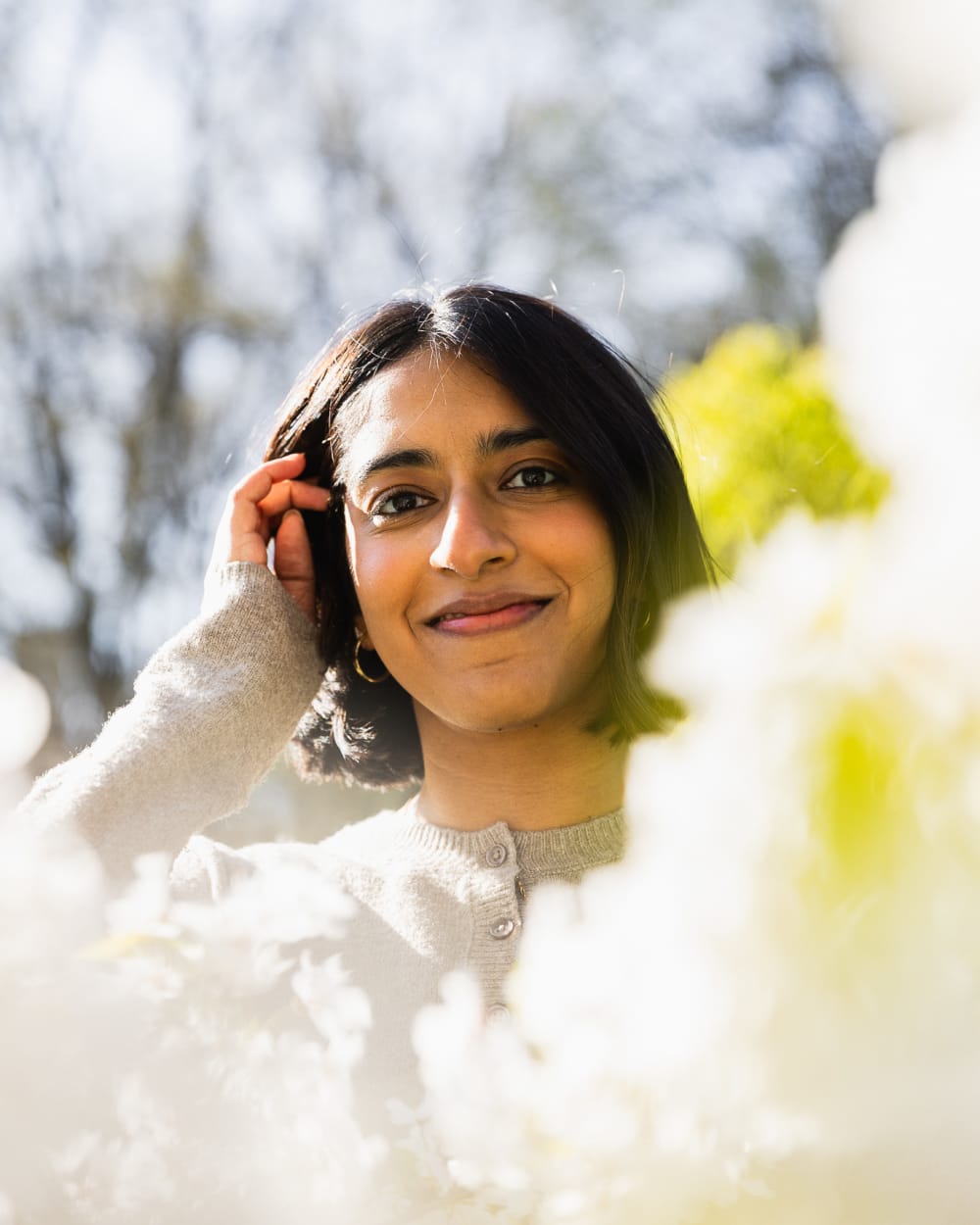 Teresa framed through cherry blossoms in Central Park