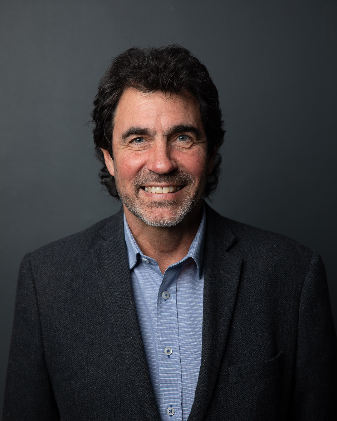 Professional headshot by Dylan van Druten — subject in a clean, mid-toned outfit, New York City