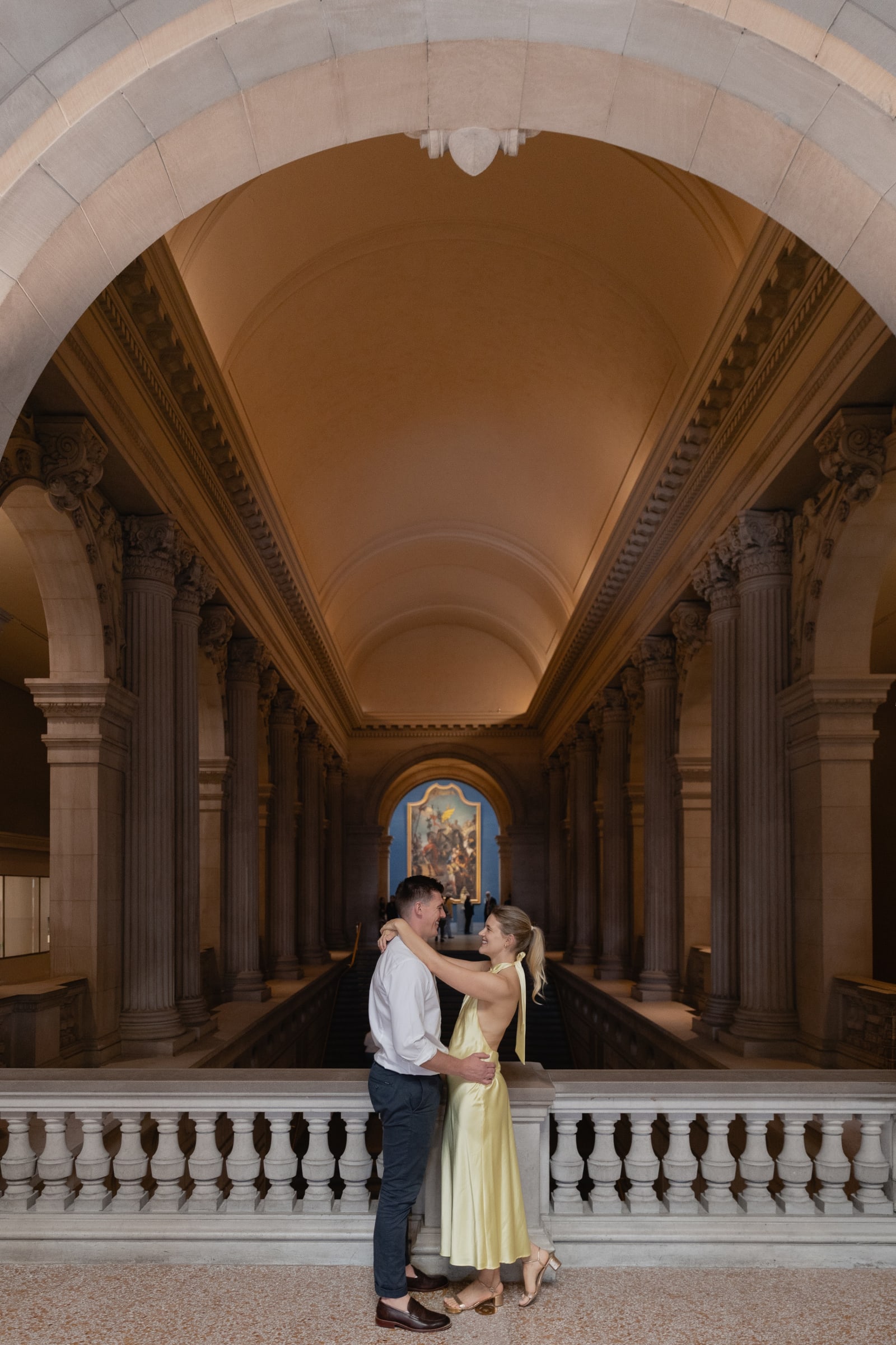 Couple photographed on the grand staircase at the Metropolitan Museum of Art in New York