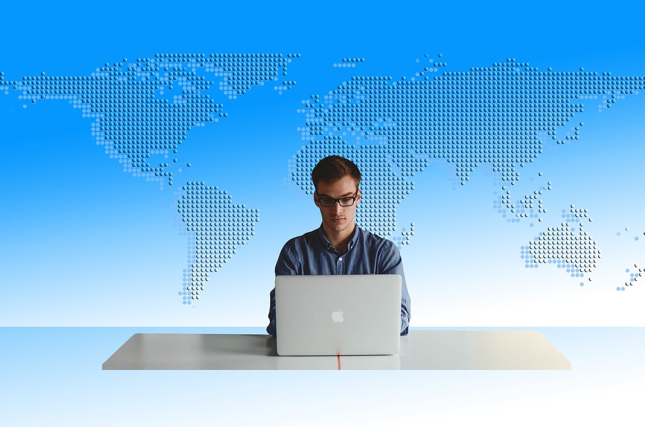 A person editing a video on a desktop screen with editing software open