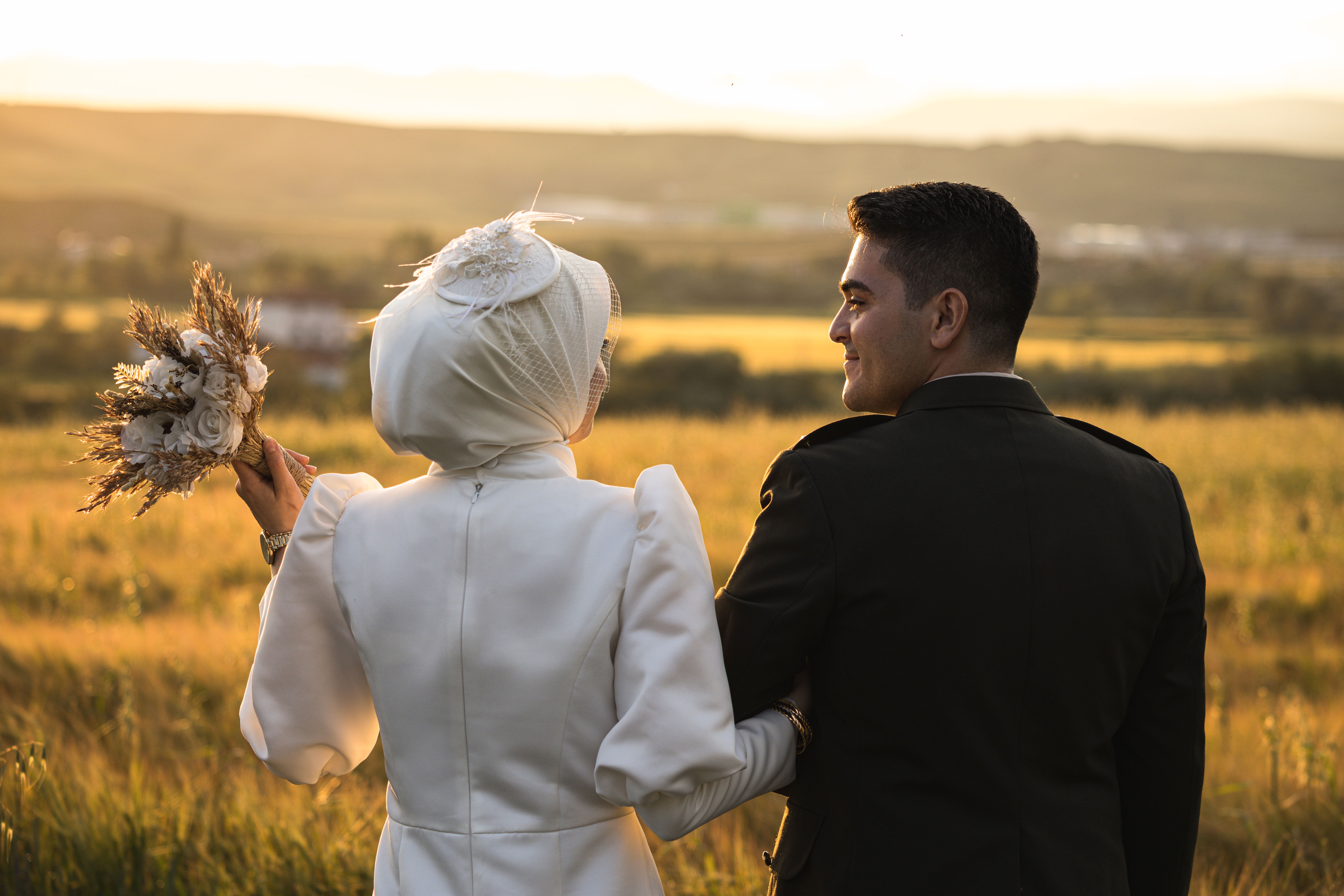 Muslim couple preparing for their nikah with family present, discussing the Islamic marriage contract and requirements.