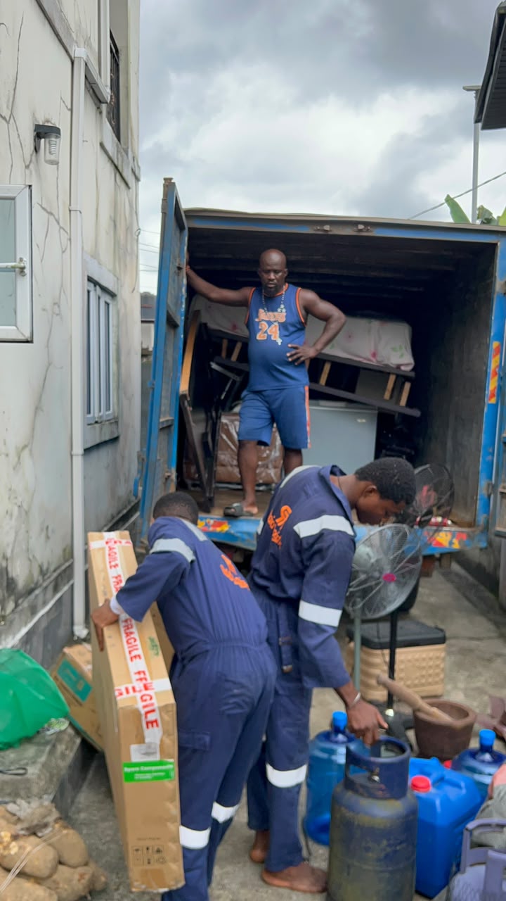 Raid Logistics movers loading household items into a truck for a house move in Nigeria
