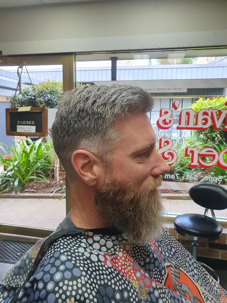 The interior of Ivan's Barber Shop, showing the modern yet classic decor.