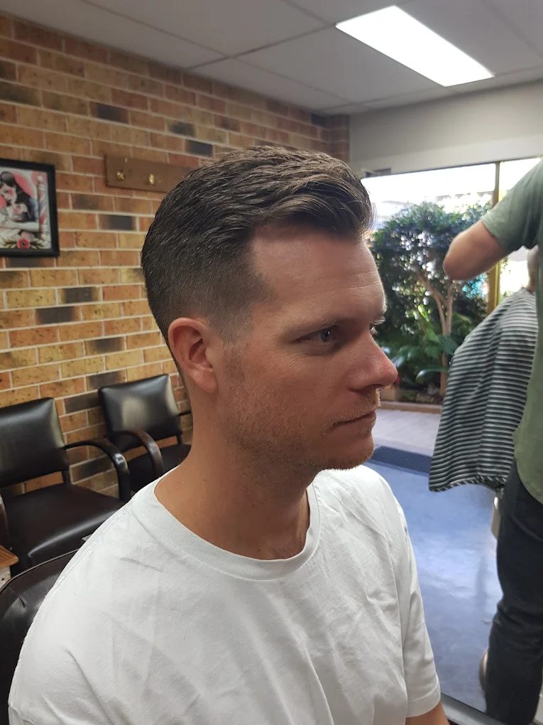 A classic pompadour haircut styled to perfection.