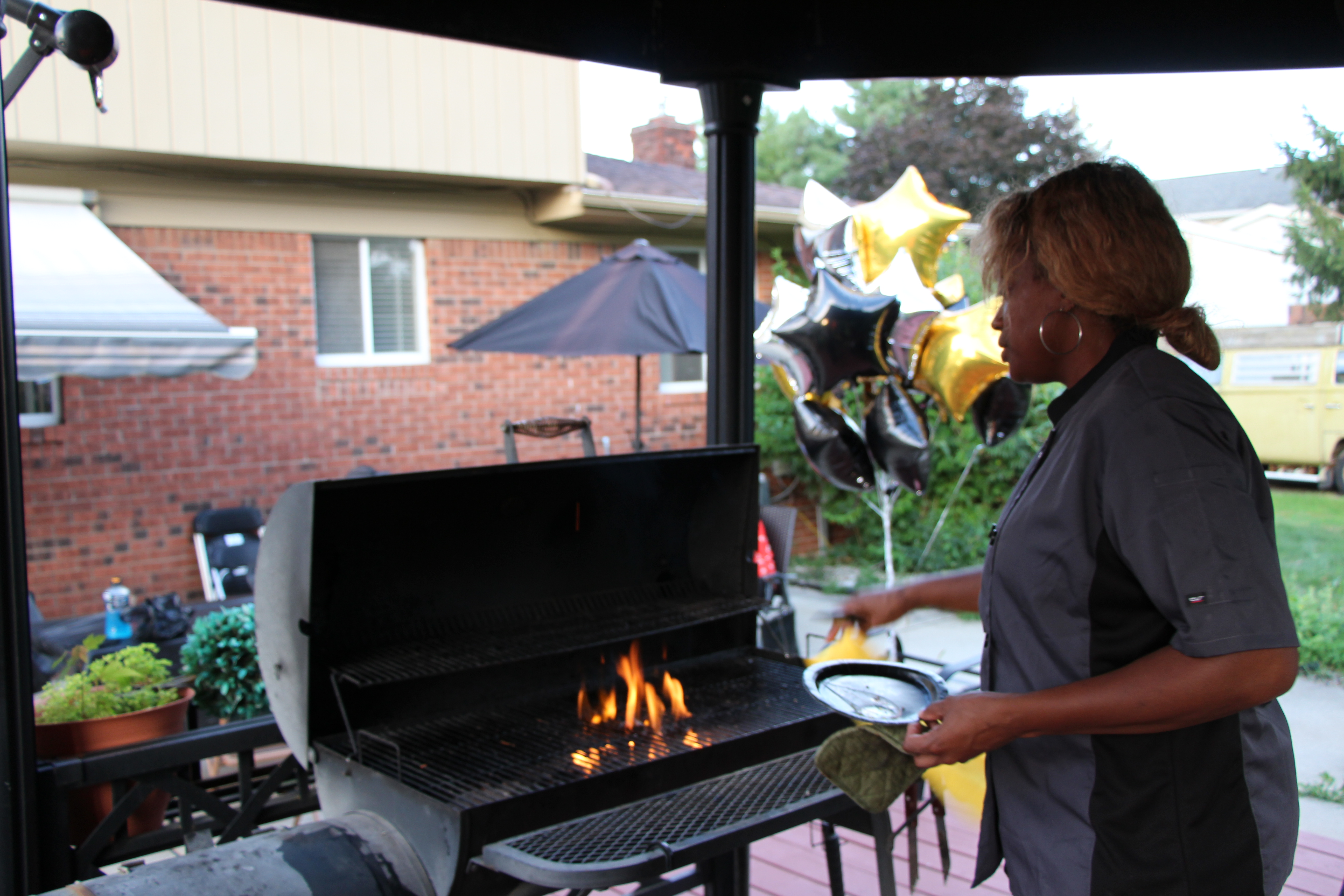 Chef Sabrina grilling at an outdoor event