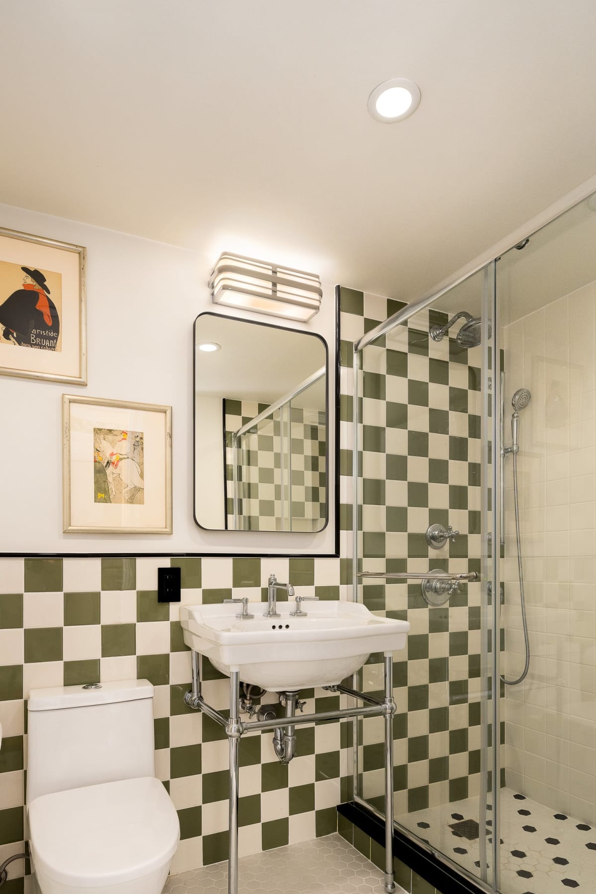 The renovated bath in green and cream checkerboard tile with Kohler chrome fixtures