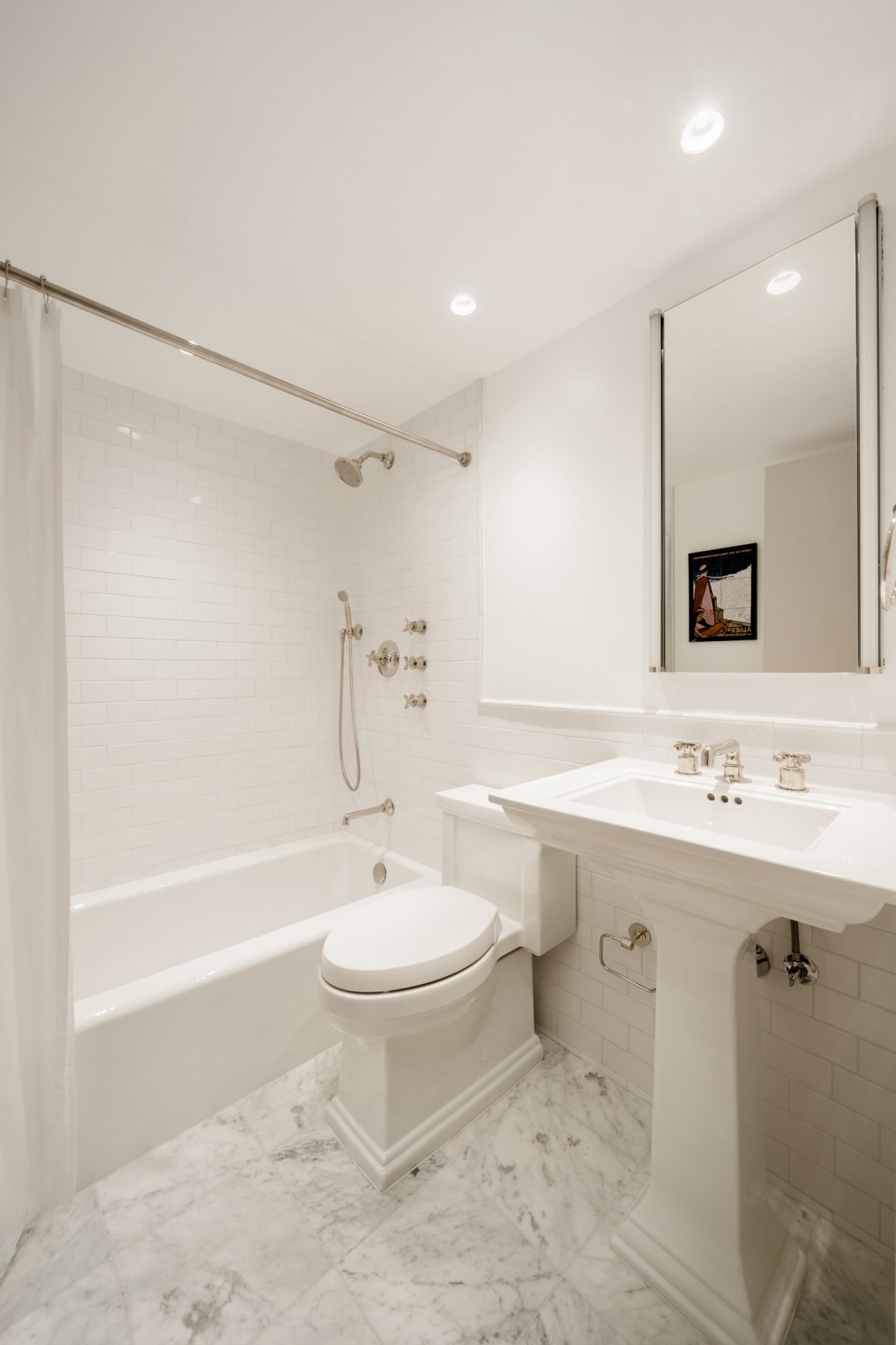 The renovated marble bath with Waterworks hardware