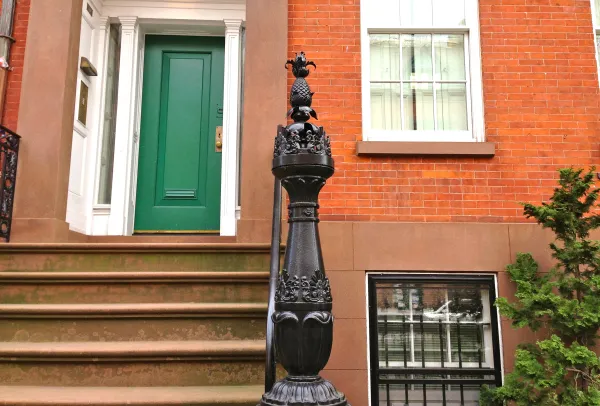 Carved pineapple detail, a Greek Revival symbol of welcome, from Cushman Row